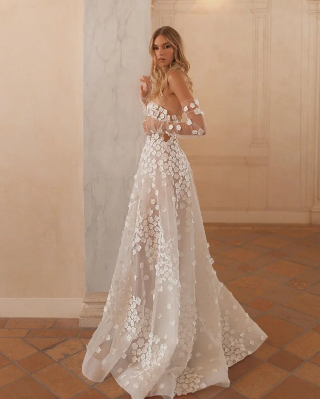 Step into elegance with our Dress Antonella. This beautiful A-line wedding dress features a sweetheart neckline and delicate appliques, making it the perfect choice for any bride on her special day. With its elegant design, our dress will make you feel like the most beautiful bride in the room.