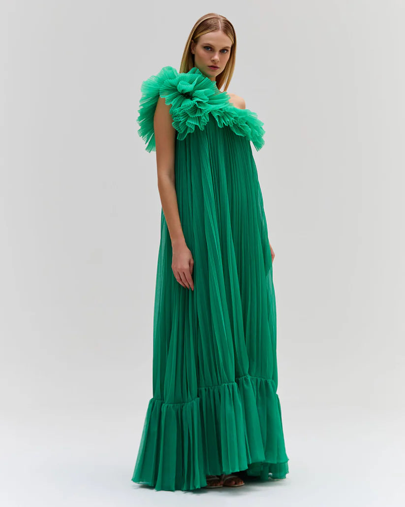 Elevate your style with the Pleated One Shoulder Gown. Made from luxurious pleated chiffon, this dress features a dramatic one shoulder neckline, adding a touch of glamour to your look. Be a part of the Spring 2024 Runway Collection and make a statement at your next event. Fully lined for maximum comfort.