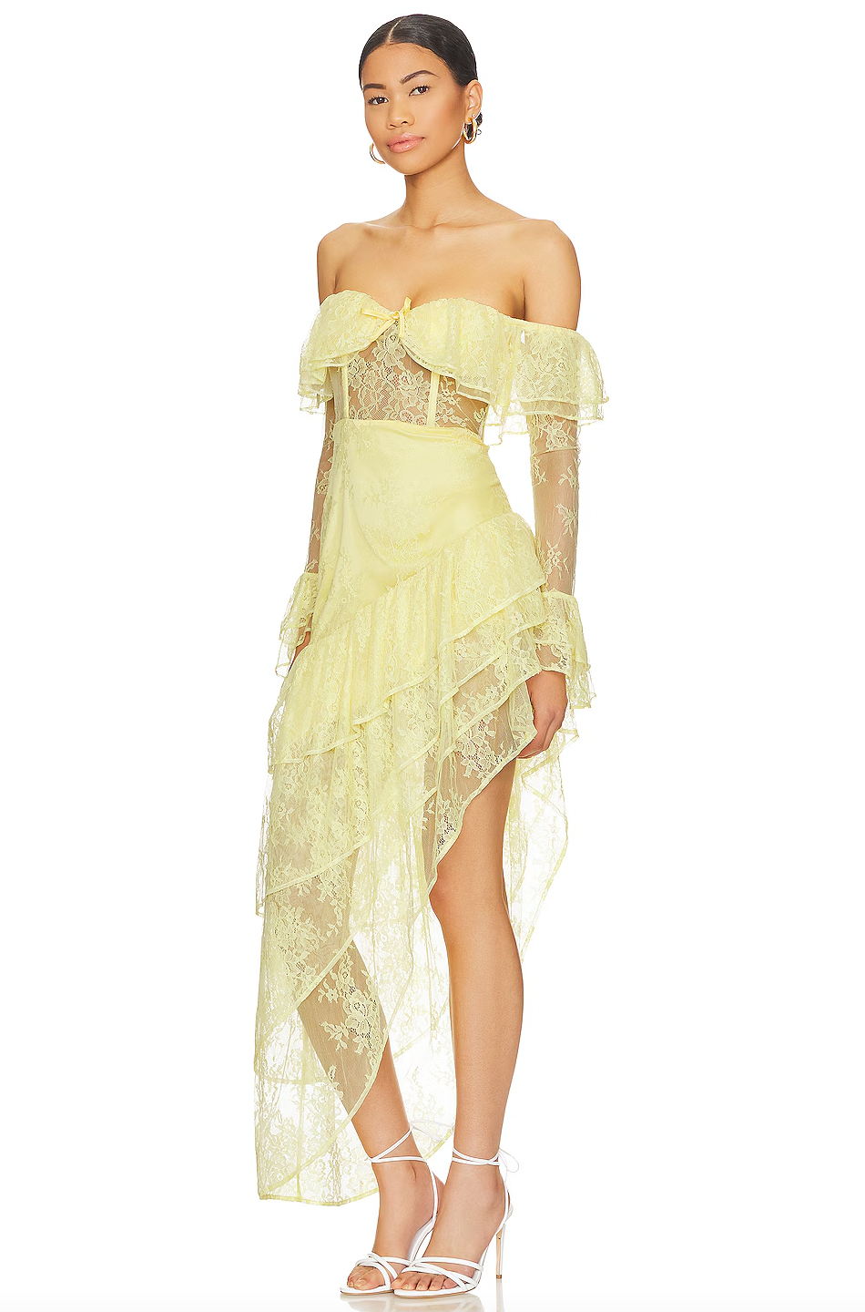 The Maddalena Gown by Majorelle combines timeless elegance with modern edge. This stunning piece features an off-shoulder silhouette with a structured boned bodice that flatters your figure, while delicate lace and playful ruffle details create movement and dimension. The asymmetric hem adds an unexpected twist that sets this gown apart, and the discreet back zipper ensures a seamless, polished look. Perfect for making an unforgettable entrance at any special occasion.