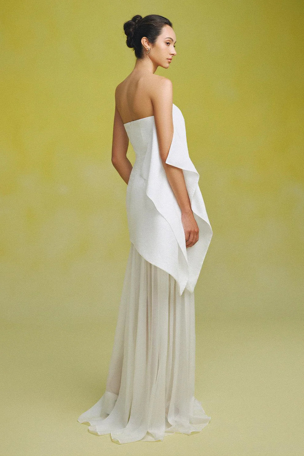 Indulge in luxury with our Gina Silk Maxi Dress. Made from premium silk chiffon, this strapless dress features elegant gatherings for a flattering and sophisticated fit. Perfect for special occasions, elevate your style with this stunning and exclusive piece.