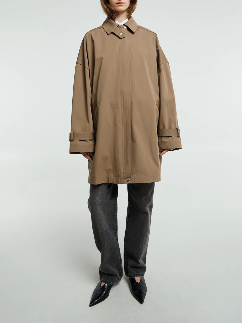 Elevate your everyday wardrobe with this timeless oversized trench jacket by Toteme in a sophisticated hazel tone. Crafted from a breathable cotton blend, it delivers effortless comfort without sacrificing style. The relaxed silhouette provides freedom of movement, making it perfect for layering through seasons. Whether you're dressing up or down, this minimalist essential transitions seamlessly from office to weekend, becoming the versatile piece you'll reach for again and again.