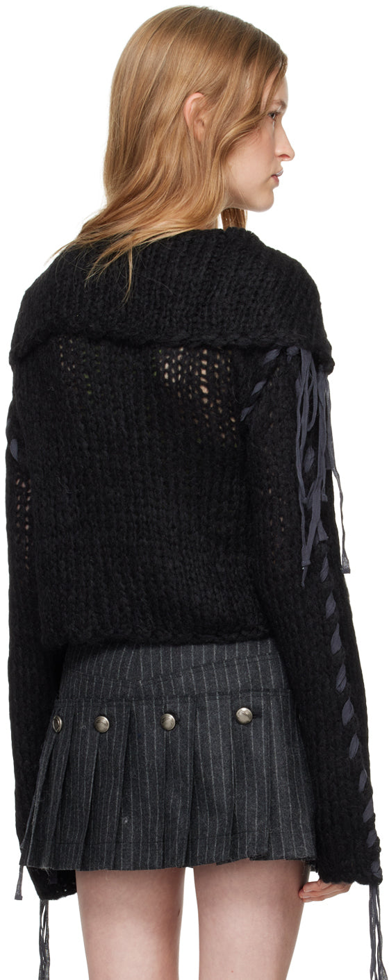 Stay cozy and stylish in the Cropped Open Knit Cardigan by Acne Studios. Made from a luxurious nylon- and wool-blend, this cardigan features cotton whipstitching and loose thread detailing for a unique touch. The oversized sailor collar and offset button closure add a modern twist to this classic piece.