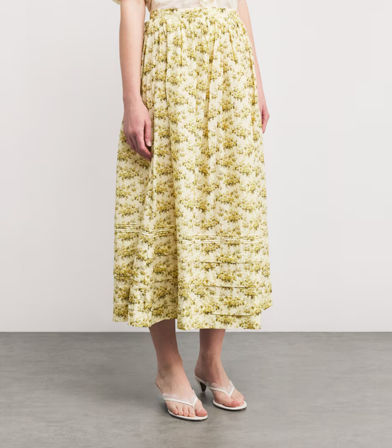 The Marcie Midi Skirt by DÔEN combines timeless romance with everyday ease. Its featherlight fabric and Victorian-inspired floral print bring a delicate, vintage charm, while subtle pintuck details enhance its graceful silhouette. Designed to move effortlessly through your day, this skirt is a versatile staple that elevates your wardrobe with minimal effort. Perfect for the woman seeking style that complements a busy lifestyle without sacrificing elegance.