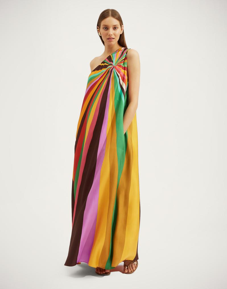 Step into the spotlight with the Roy Dress by La Double J, a one-shouldered showstopper inspired by the golden era of disco glamour. Crafted from luxurious silk twill sourced from Como, this voluminous column silhouette cascades elegantly off the shoulder, flowing into a generous floor-sweeping skirt that commands attention at every occasion. Practical yet stunning, it features hidden pockets and a captivating hand-placed print that speaks volumes without saying a word. 