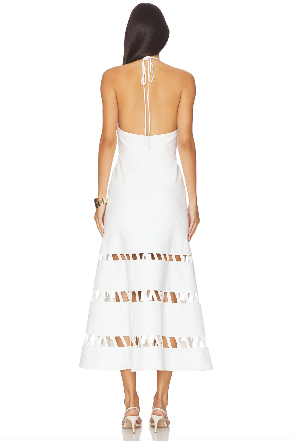 The Janessa Dress by Alexis blends timeless comfort with chic modern design. Crafted from breathable cotton, it keeps you cool and comfortable all day. The elegant halter neckline and midi length offer versatile styling for any warm-weather event. Unique cut-out ladder detailing adds a sophisticated texture, elevating your look effortlessly. Perfect for those seeking a refined yet comfortable dress.