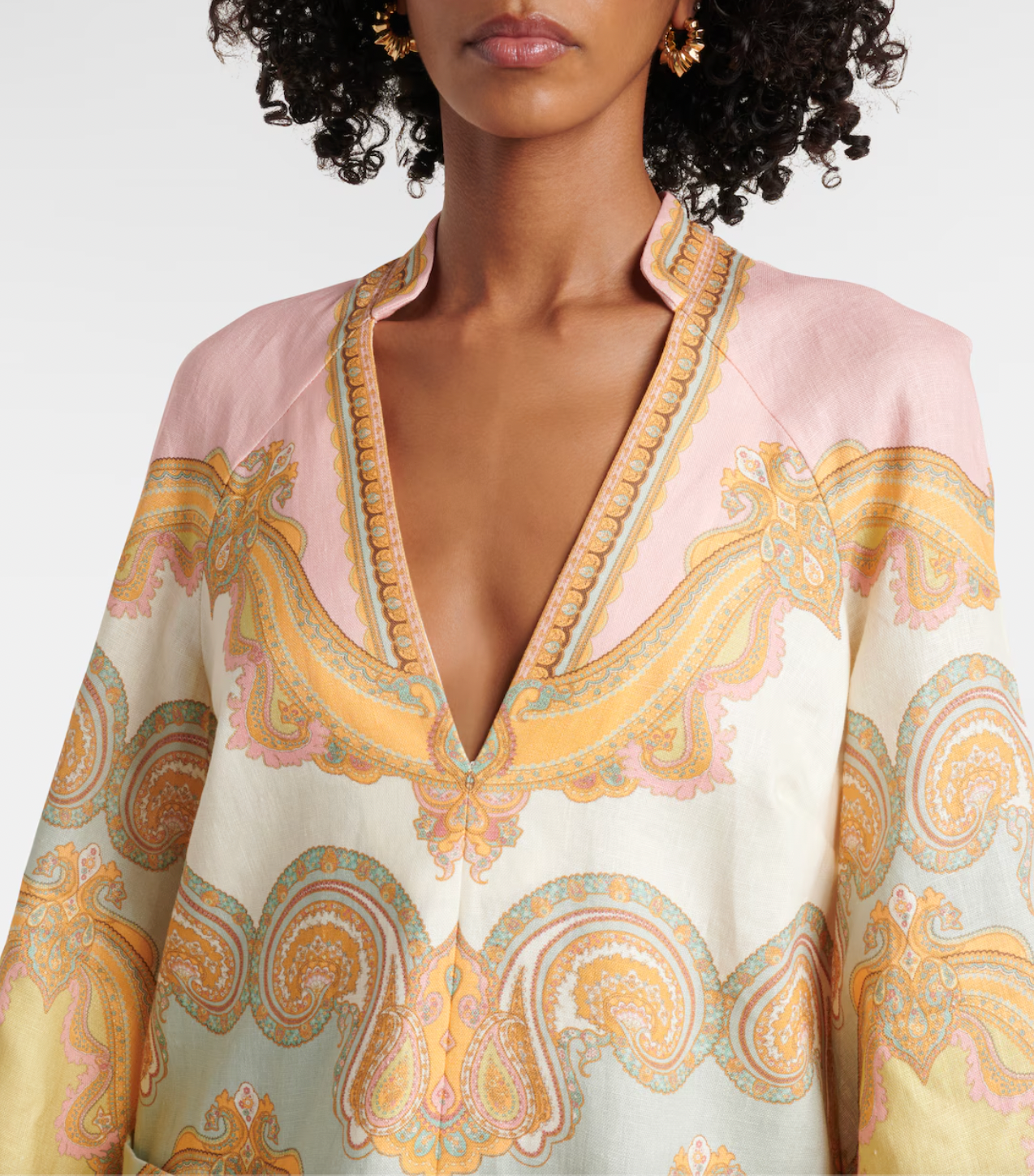 Elevate your resort style with the Maxine paisley linen minidress in Gold Paisley by Zimmermann. Made from breathable linen, this dress combines comfort with elegance, featuring a deep V-neckline and wide sleeves that enhance its chic appeal. Practical patch pockets add convenience, while the center back zip provides a tailored fit. Perfect for relaxed daytime outings or sophisticated evening events, this dress is a versatile addition to your wardrobe.