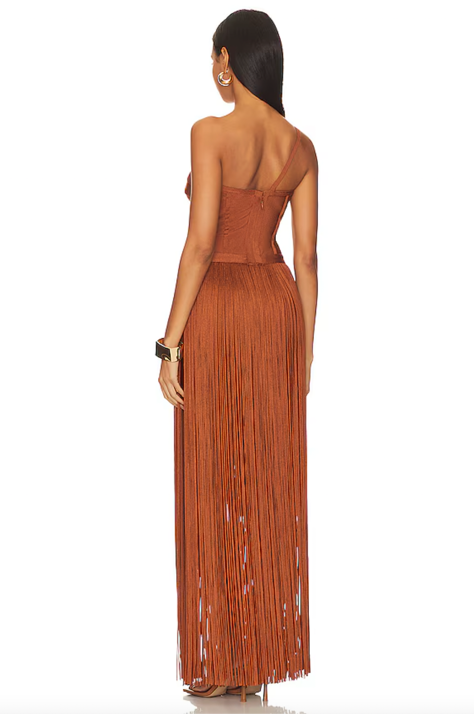 Elevate your style with Hervé Léger's Draped Fringe One Shoulder Gown. The stunning swingy fringe and draped cross-over bodice exude elegance and sophistication, making it perfect for exclusive events. With an asymmetric one-shoulder neck and layered skirt, indulge in luxurious fashion.
