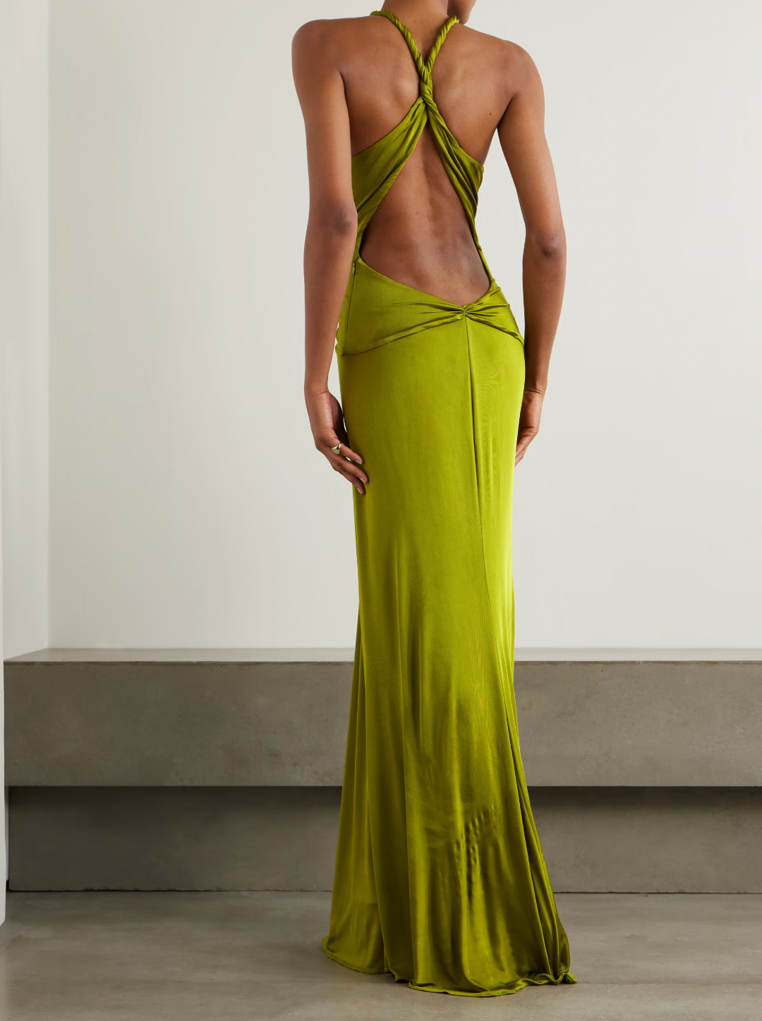 Elevate your evening in the Open-back Twist-front Jersey Gown by Tom Ford. Designed to impress, the plunging neckline and twisted front create beautiful drapes that flow to the floor. With eye-catching rolled shoulder straps and an alluring open back, this gown will make you the center of attention.