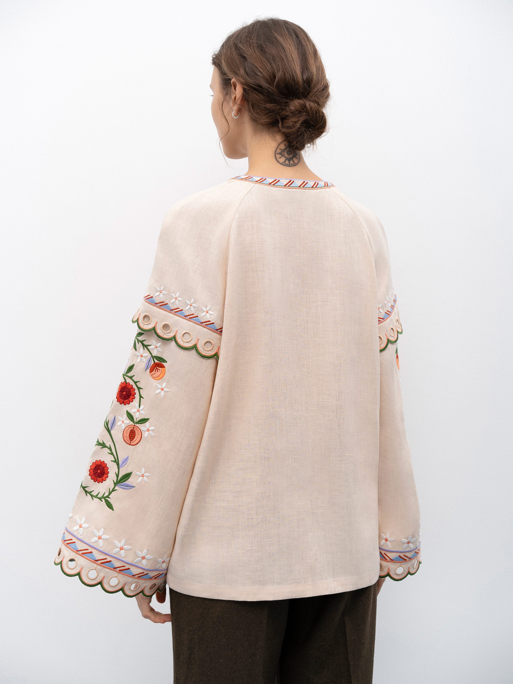 Get ready to turn heads with the Leena Embroidered Blouse! This stylish blouse features a beautiful 3D flower embroidery, flared sleeves, and a chic lace-up neckline. Embrace your unique fashion sense with this vintage-inspired piece.