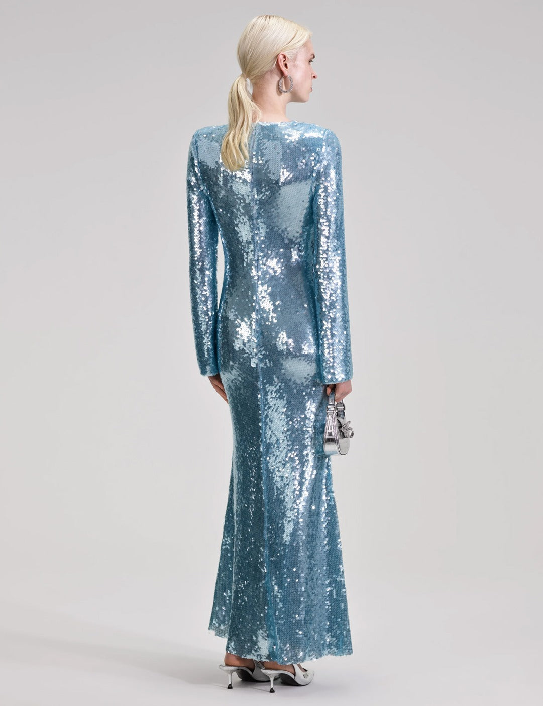 Indulge in glamour and shine with Self-Portrait's Sequin Maxi Dress. Crafted from a comfy woven fabric, this dress flatters with a shapely, slim fit and is adorned with sparkling sequins. Perfect for balls or disco nights, the dress creates a mesmerizing mirror ball effect. Let your inner diva shine!