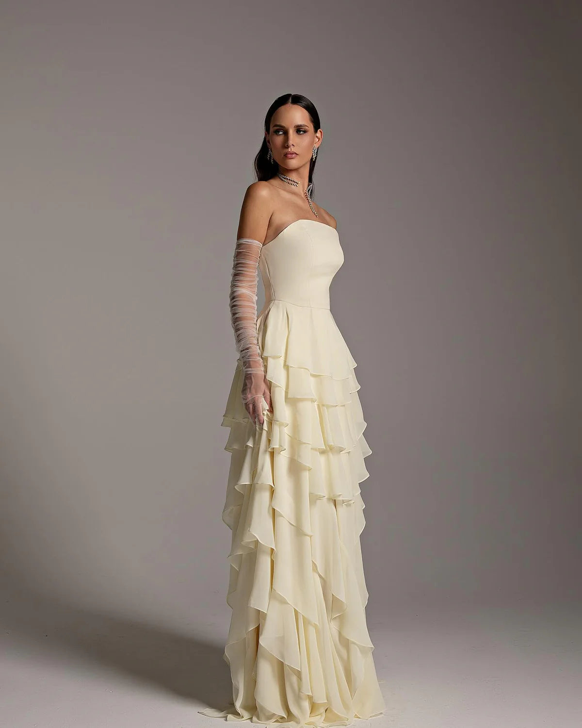 The Alexandra Gown is an elegant and sophisticated evening dress, perfect for formal occasions and weddings. Its flattering mermaid silhouette, flowing cut, and long sleeves create a sophisticated look. The unique criss-cross design adds a modern twist to this traditional Arabic design. Make a statement with this stunning piece!