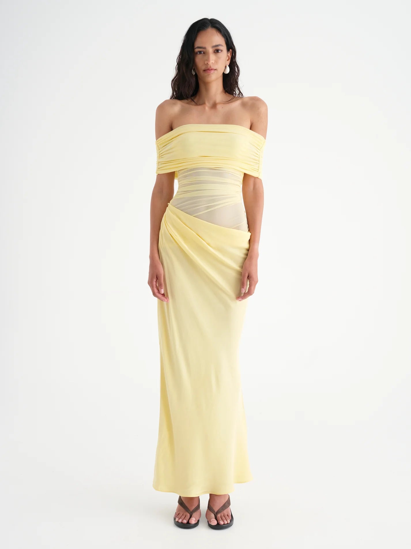 Introducing Nico, the sophisticated version of our Yasmin Maxi Dress. The off-shoulder design and cowl on the left side waist creates a flattering silhouette, while the overlapping skirt and mesh bodice add depth. Enhance your feminine charm with the option to show off some skin on the left hand side waist.