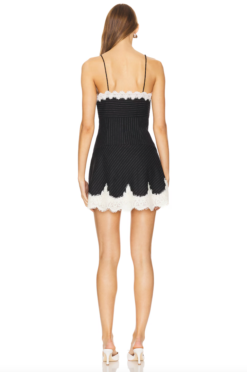 The Teddi Mini Dress combines classic pinstripes with delicate lace accents to create a look that’s both sophisticated and modern. Featuring spaghetti straps and an empire waist, it flatters your figure while the tailored yoke adds elegant shaping. The flowing A-line skirt with scalloped lace hem adds subtle charm, and the hidden side zipper ensures a smooth, comfortable fit. Perfect for any event where style and refinement are a must.