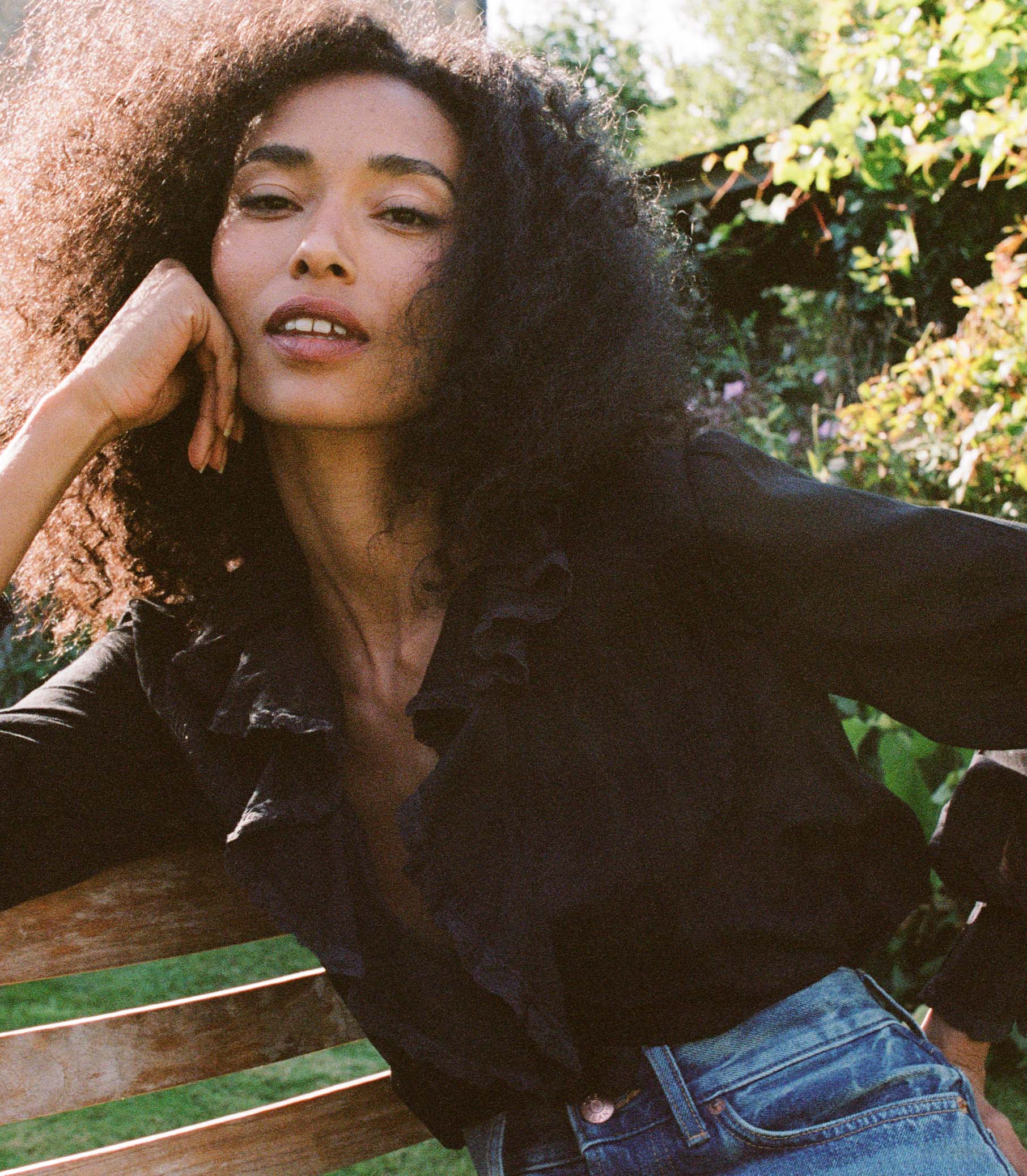 Introducing the Hardy Top in Black by Doen, an effortlessly elegant blouse that exudes French girl charm. With full sleeves, a delicate ruffle, and mother of pearl buttons, this blouse radiates sophistication. Crafted in 1970s-inspired pintucked design, it's perfect for any occasion - from casual outings to refined looks. Elevate your style with this versatile and comfortable blouse.