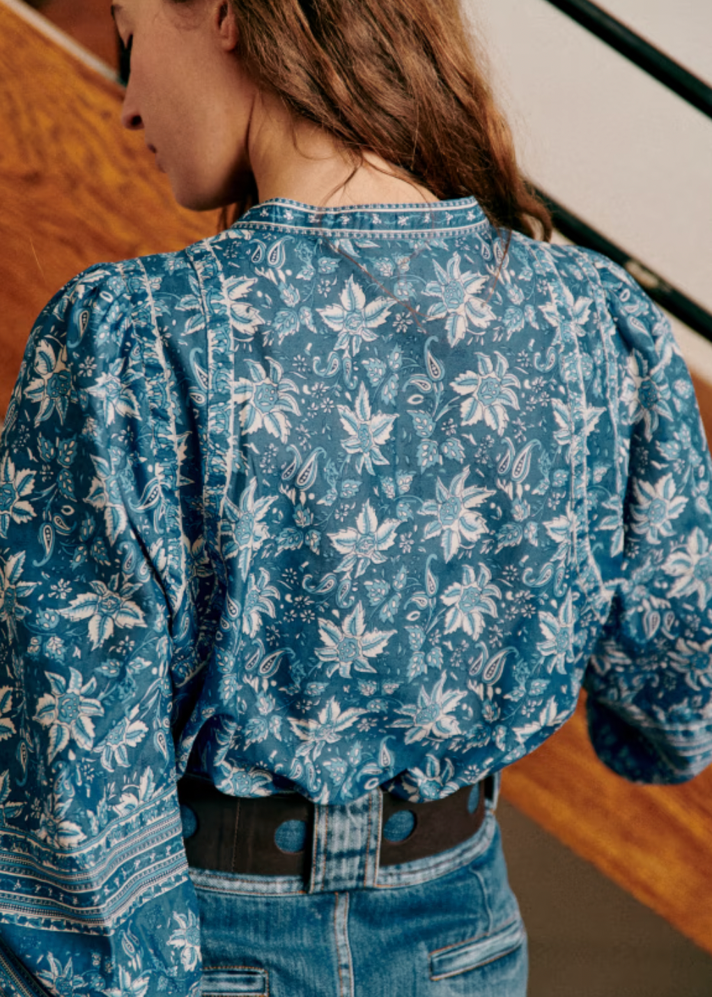 The Mariana Shirt by Sezane combines classic sophistication with modern style. Featuring an officer collar and button-down front, this long sleeve shirt offers a polished look perfect for any occasion. Its wide sleeves are elegantly gathered at the shoulders and cuffs, creating a graceful silhouette that cinches at the wrist for a tailored finish. Elevate your wardrobe with this statement piece that balances comfort and chic design effortlessly.