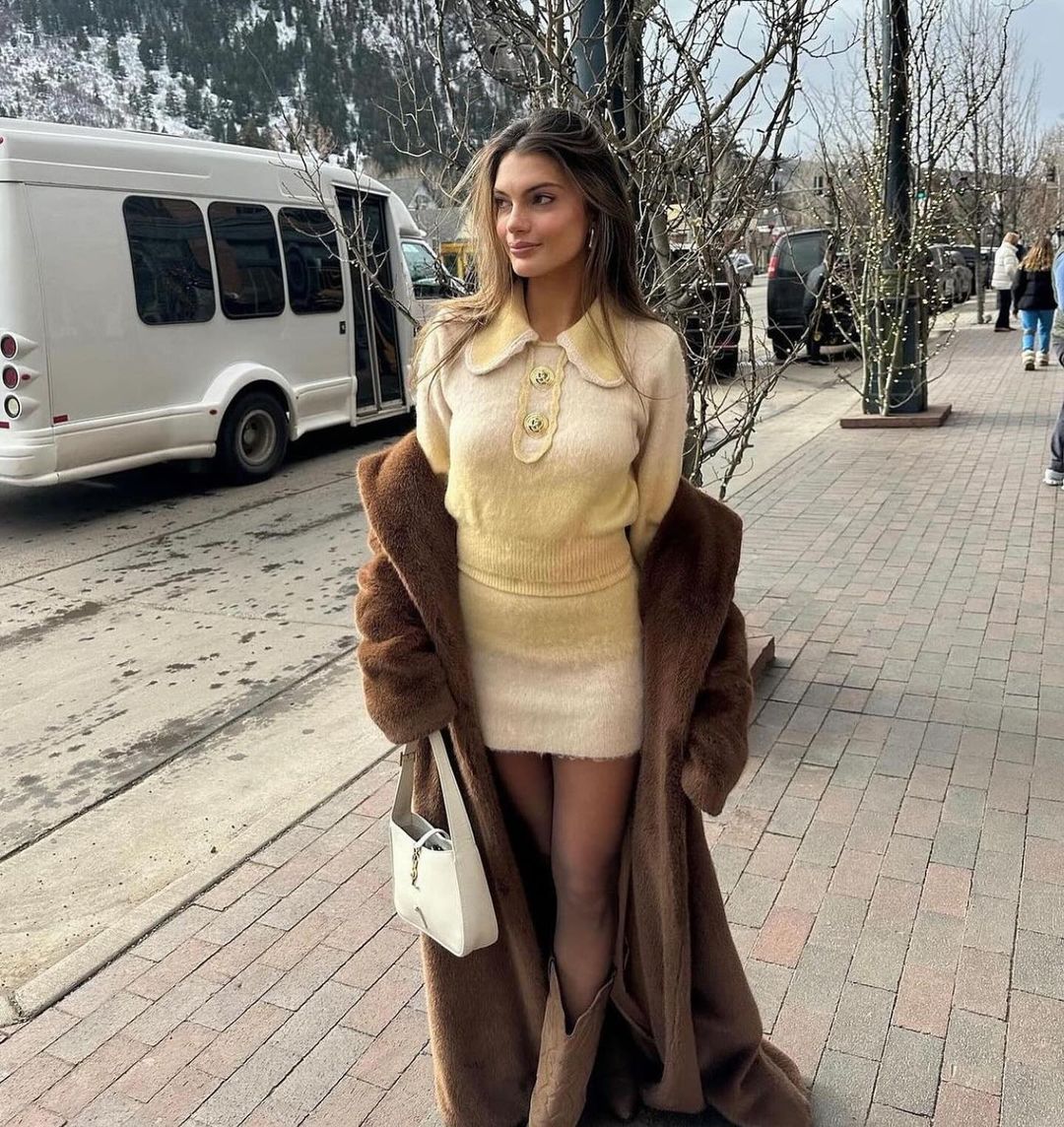 The Emily Set is the epitome of retro-glamour with its knit cardigan and bodycon skirt. The intricate stitching and gold custom buttons add a touch of elegance to this timeless two piece set. Made with luxurious alpaca wool yarn, this set is sure to keep you warm while making a statement. Complete with shoulder pads for added shape and style.