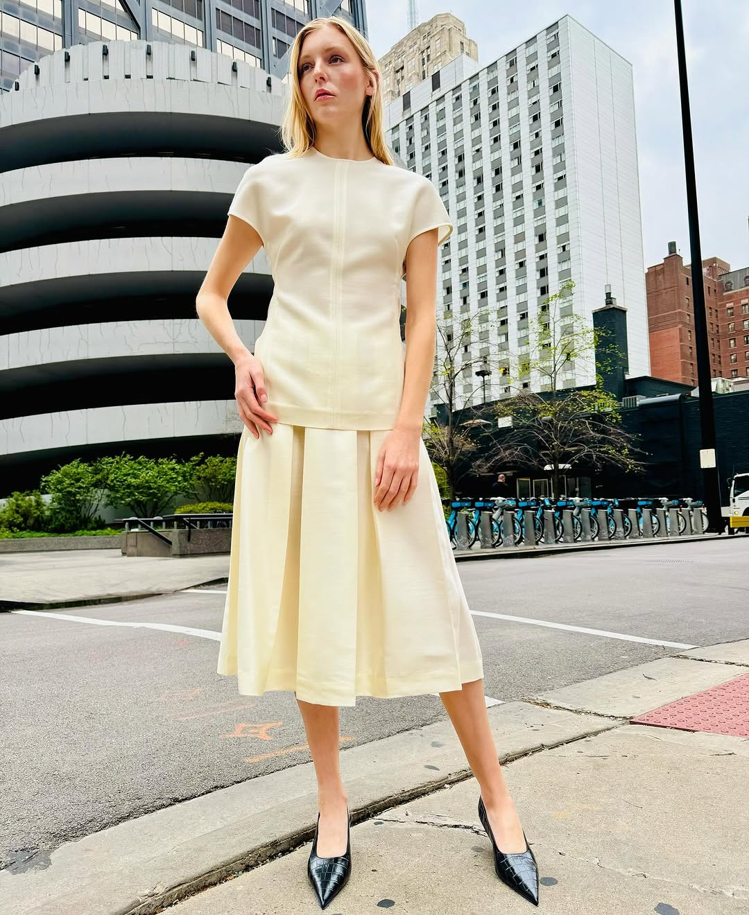 Discover understated luxury with this cap-sleeve top by Toteme, where contemporary design meets timeless sophistication. The elongated cut creates a flattering silhouette while twisted seams introduce subtle architectural detail. Constructed from premium double-faced cady blended with wool and silk, it delivers exceptional comfort without compromising on durability. A hidden back zipper provides a clean, refined finish—perfect for seamless layering or standalone elegance. 