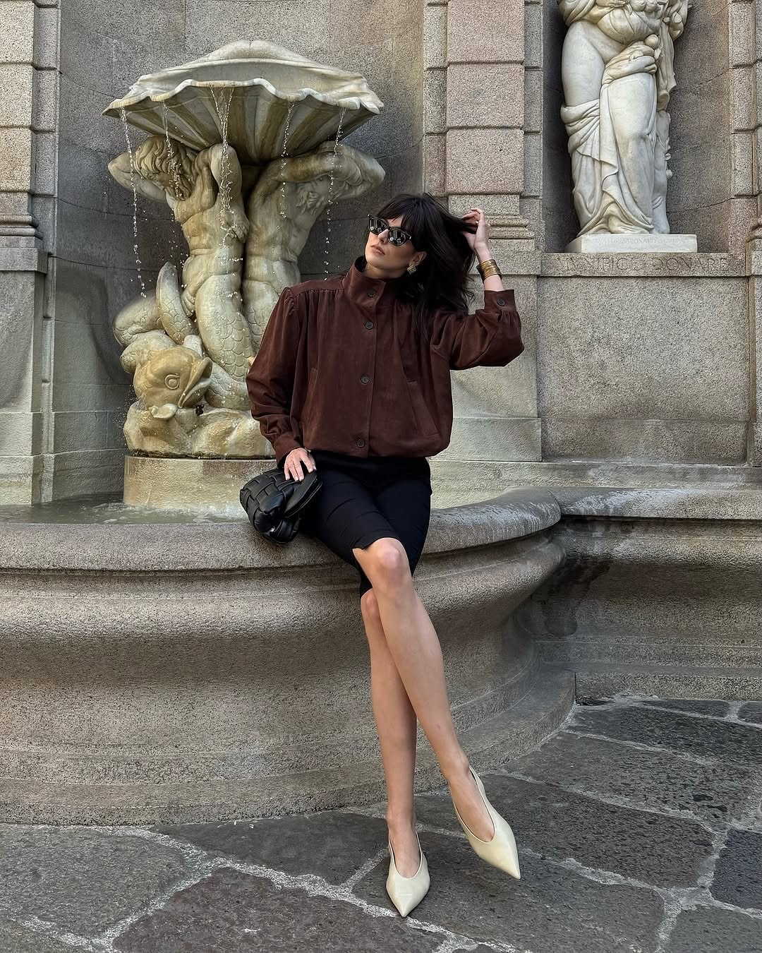 This Ruched Suede Jacket in Brown blends timeless style with contemporary flair. Featuring a boxy silhouette and padded shoulders, it exudes confidence, while the stand collar and gathered pleats add refined detail. The softly structured waistband creates a relaxed blouson effect, offering a polished look that’s both comfortable and stylish. Fully lined for all-day ease, this jacket effortlessly enhances any outfit with understated sophistication.