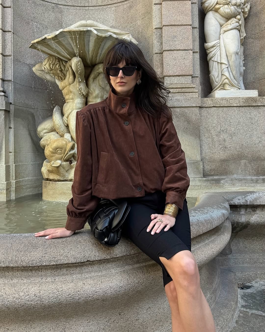 This Ruched Suede Jacket in Brown blends timeless style with contemporary flair. Featuring a boxy silhouette and padded shoulders, it exudes confidence, while the stand collar and gathered pleats add refined detail. The softly structured waistband creates a relaxed blouson effect, offering a polished look that’s both comfortable and stylish. Fully lined for all-day ease, this jacket effortlessly enhances any outfit with understated sophistication.