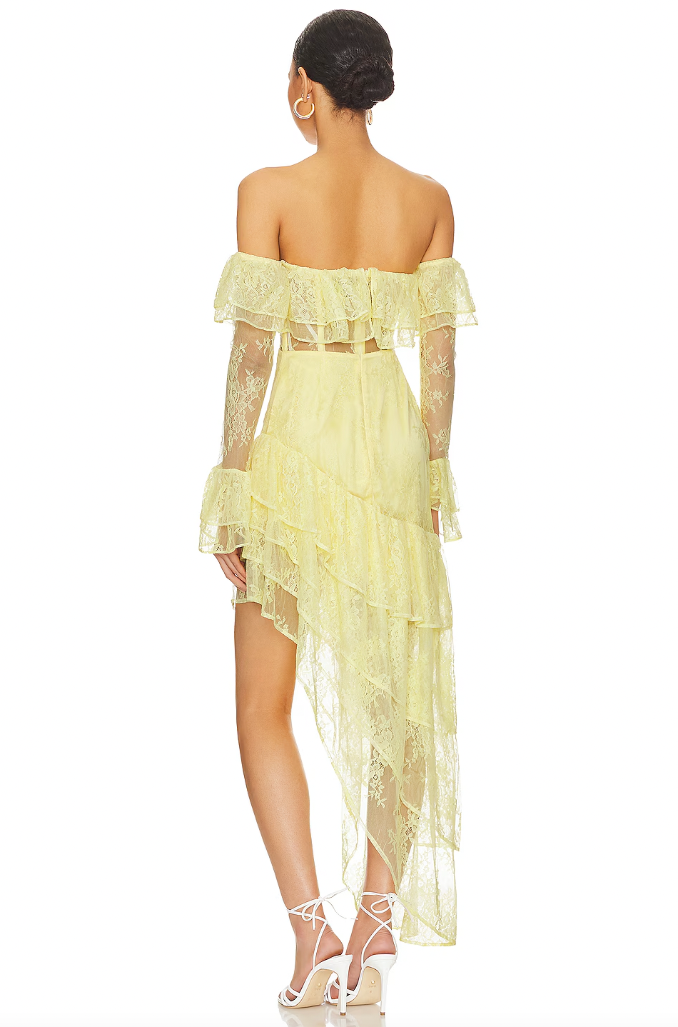 The Maddalena Gown by Majorelle combines timeless elegance with modern edge. This stunning piece features an off-shoulder silhouette with a structured boned bodice that flatters your figure, while delicate lace and playful ruffle details create movement and dimension. The asymmetric hem adds an unexpected twist that sets this gown apart, and the discreet back zipper ensures a seamless, polished look. Perfect for making an unforgettable entrance at any special occasion.