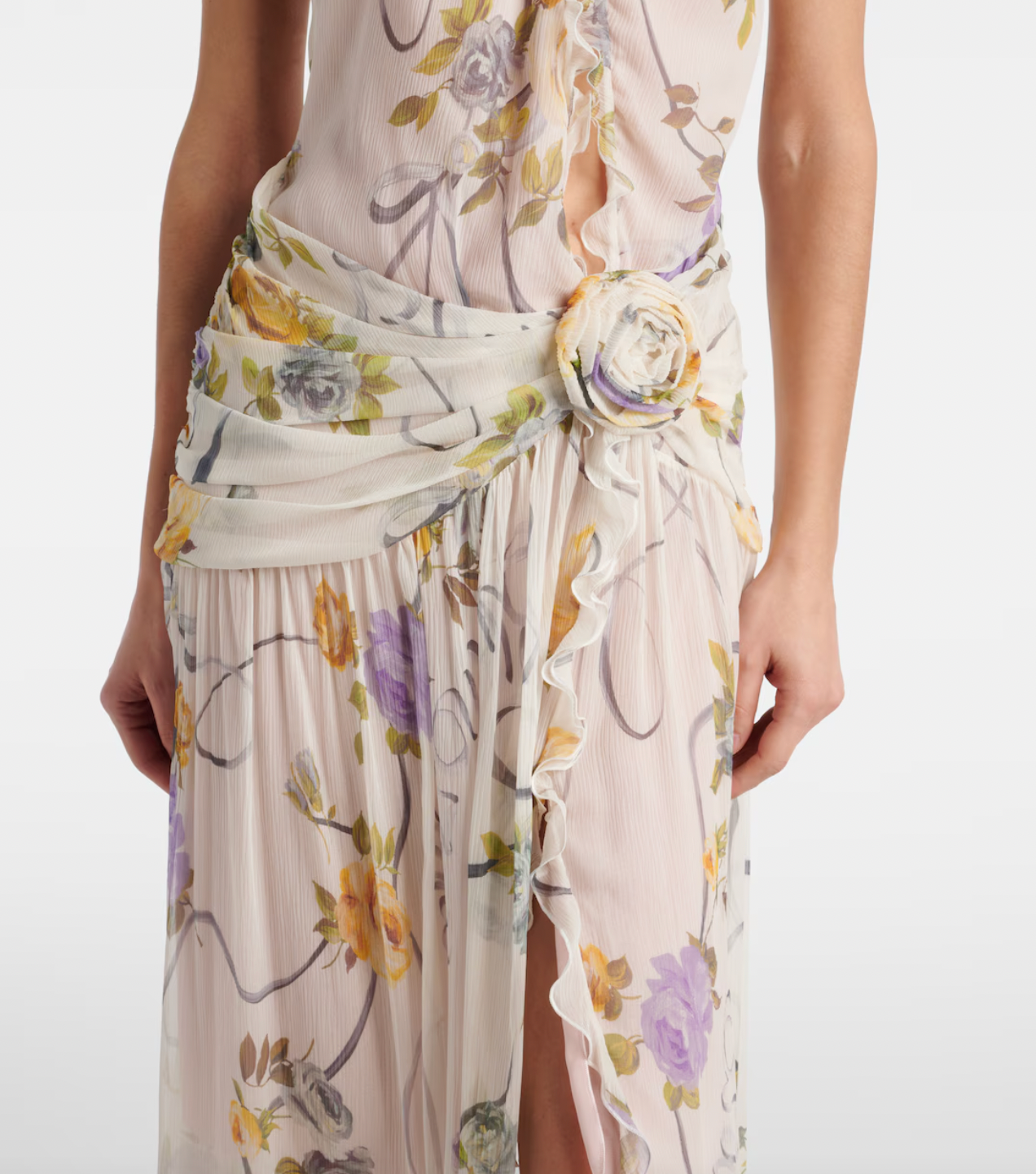 Step into a garden of elegance with this Floral Silk Creponne Maxi Dress by Blumarine. Its flowing silk fabric drapes beautifully, while vibrant floral patterns add a touch of whimsy. Perfect for dancing through sunny days or dreamy evenings, this dress combines comfort with effortless charm to brighten any occasion.
