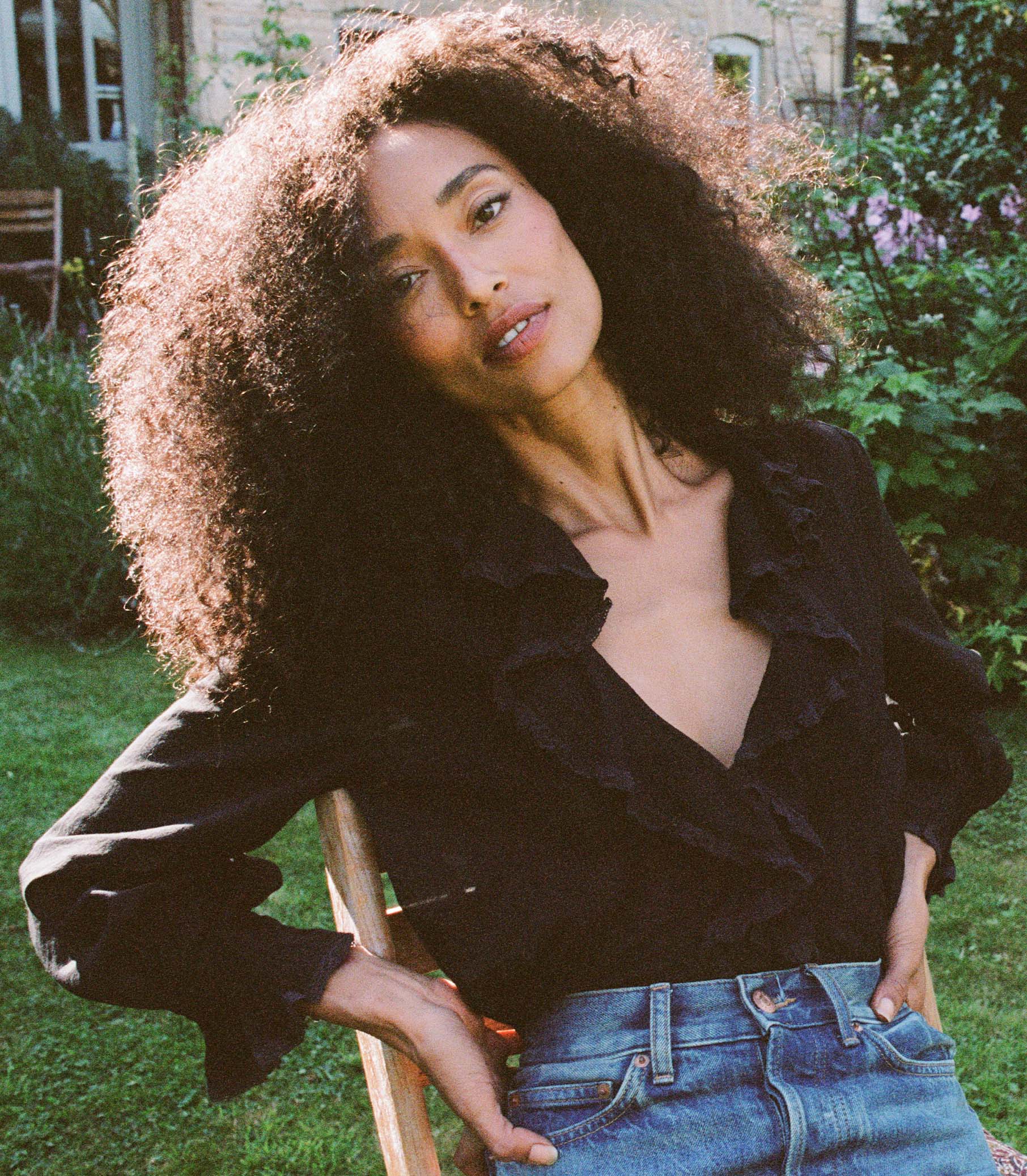 Introducing the Hardy Top in Black by Doen, an effortlessly elegant blouse that exudes French girl charm. With full sleeves, a delicate ruffle, and mother of pearl buttons, this blouse radiates sophistication. Crafted in 1970s-inspired pintucked design, it's perfect for any occasion - from casual outings to refined looks. Elevate your style with this versatile and comfortable blouse.