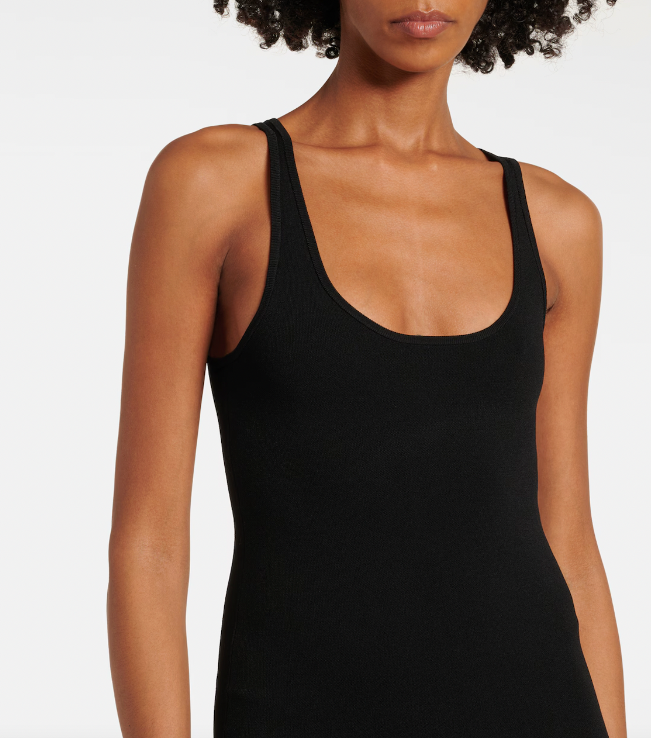 Elevate your evening look with this sleek black maxi dress by Toteme. Featuring a fine knit fabric and a panelled design, it offers both comfort and subtle sophistication. The sleeveless scoop neck and unlined construction keep the silhouette light and breathable, while the flared, long skirt adds graceful movement. Perfect for formal occasions, this dress combines understated elegance with a modern edge.