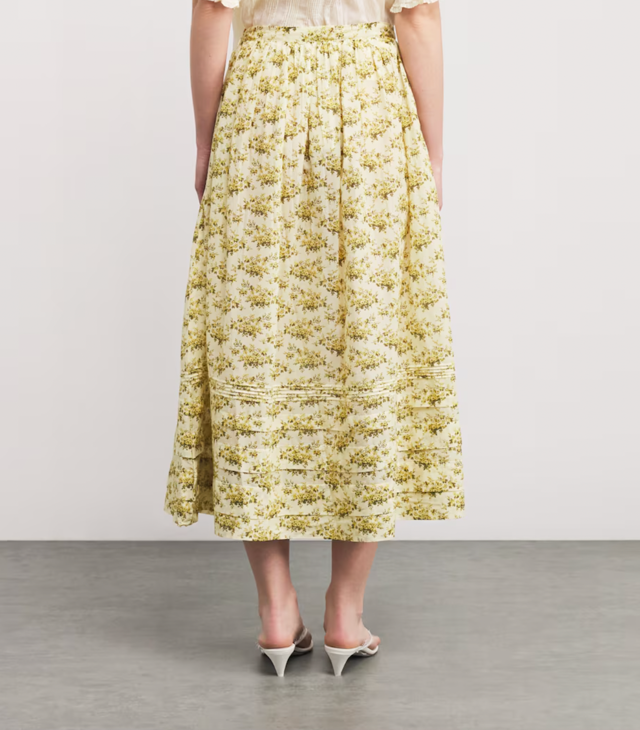 The Marcie Midi Skirt by DÔEN combines timeless romance with everyday ease. Its featherlight fabric and Victorian-inspired floral print bring a delicate, vintage charm, while subtle pintuck details enhance its graceful silhouette. Designed to move effortlessly through your day, this skirt is a versatile staple that elevates your wardrobe with minimal effort. Perfect for the woman seeking style that complements a busy lifestyle without sacrificing elegance.