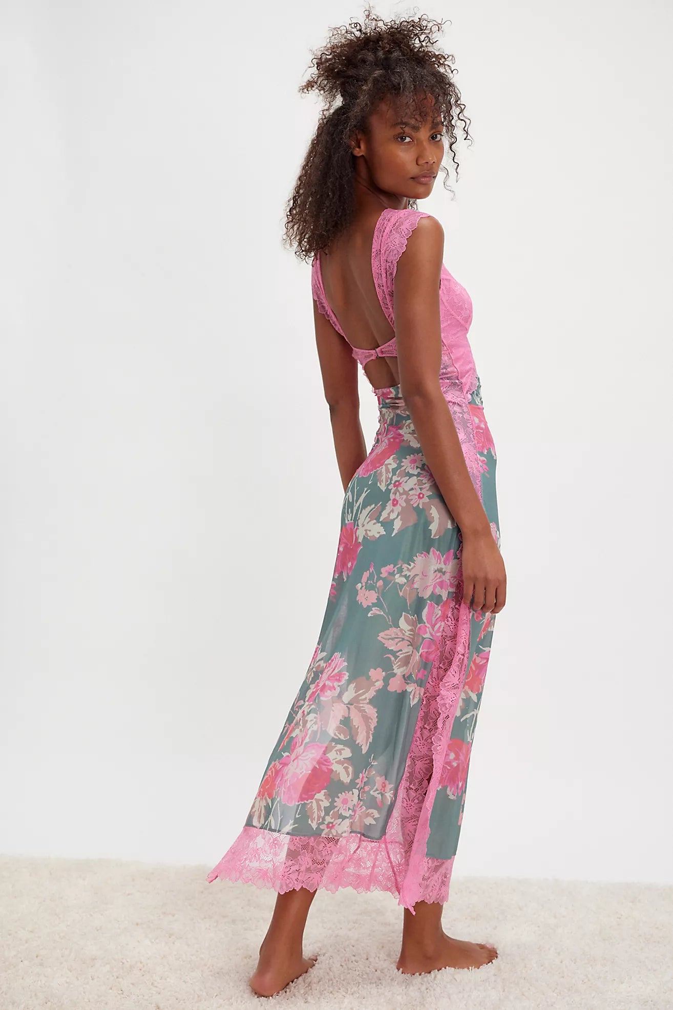 Slip into this sultry maxi and command attention. The sweetheart neckline and daring back cutout create an irresistible silhouette, while delicate sheer mesh with floral print and intricate lace detailing add sophistication. A front bust cutout and side-slit detailing showcase your style with confidence. The formfitting design flows to a graceful maxi length, finished with cap-inspired sleeves and a hook closure. Perfect for those moments when you want to feel absolutely captivating.