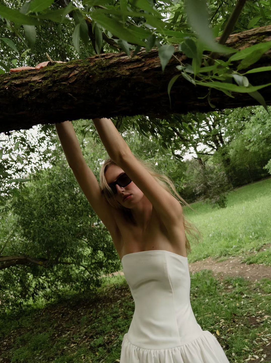 The Mayfair Dress offers timeless sophistication with a modern twist. Featuring a strapless, solid bodice and a flattering A-line silhouette, it highlights your figure with a high waist and pleated skirt that flows elegantly. Perfect for summer events and upscale parties, this sleeveless dress ensures comfort while exuding effortless grace, making it the ideal choice for warm-weather style.