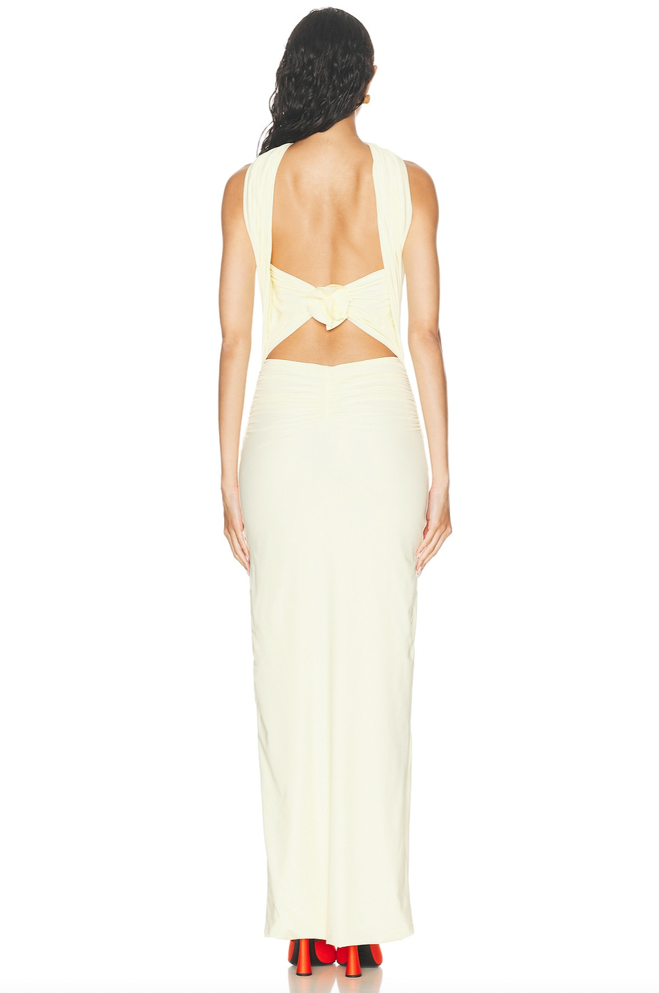 Discover the Maygel Coronel Mullett Dress—a captivating pale yellow maxi that commands attention with its sleek, body-skimming silhouette and daring knotted open back. Crafted from luxuriously smooth fabric, this piece exudes understated elegance while making a bold statement. Whether you're attending a summer soirée or an upscale cocktail gathering, this versatile dress transitions effortlessly from evening glamour to refined daytime sophistication. 