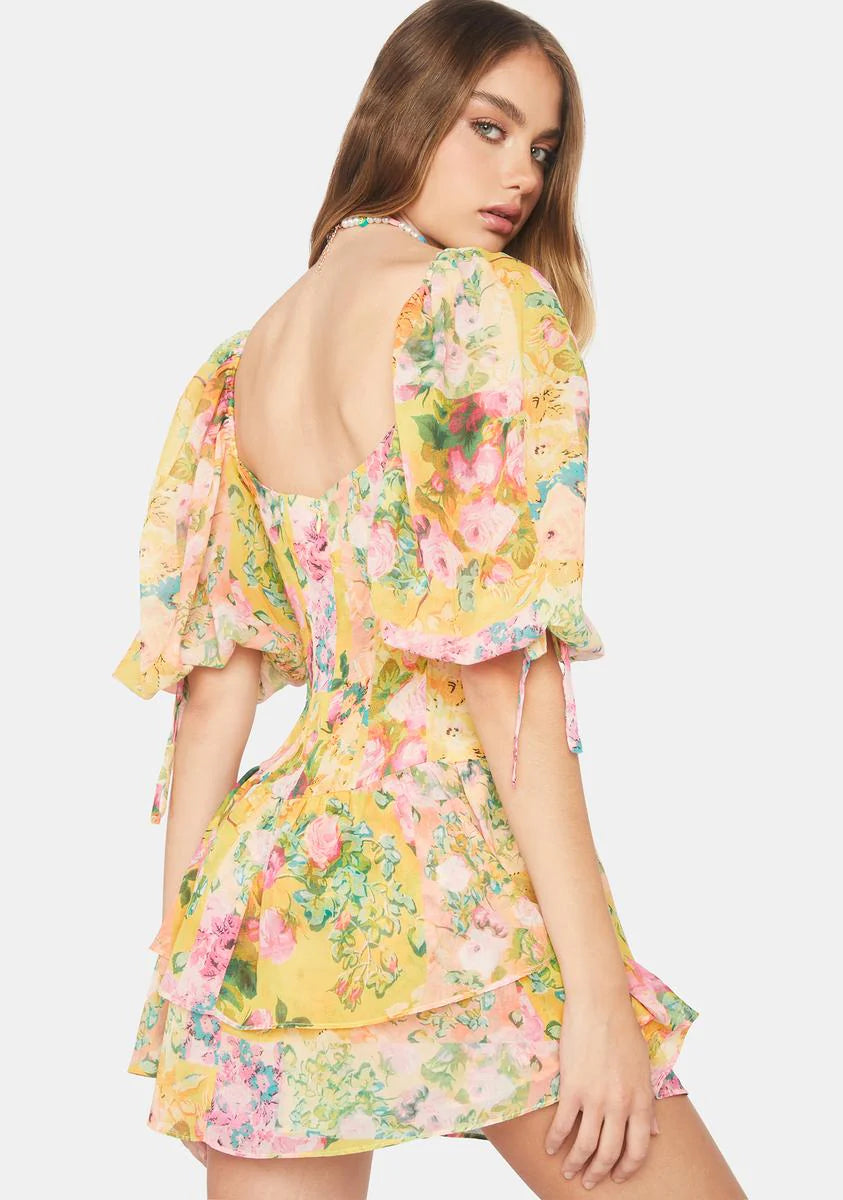 Introducing the playful and quirky Nina Mini Dress by For Love & Lemons! With its puff sleeves, square neckline, and ruched bodice, this mini dress offers a flattering and stylish silhouette. The feminine ruffle details and floral print add charm, while the convenient zip closure elevates your wardrobe. Don't miss out on this must-have piece!