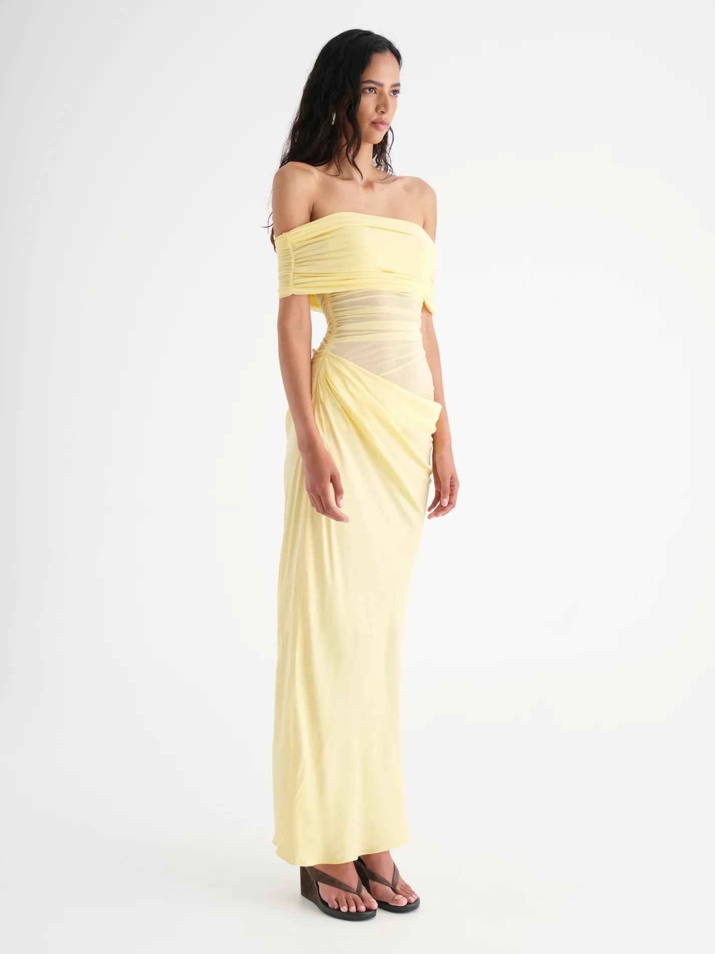 Introducing Nico, the sophisticated version of our Yasmin Maxi Dress. The off-shoulder design and cowl on the left side waist creates a flattering silhouette, while the overlapping skirt and mesh bodice add depth. Enhance your feminine charm with the option to show off some skin on the left hand side waist.