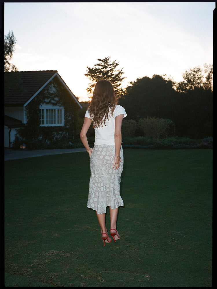 Experience the flirty and feminine charm of The Carmen in Absinthe by Realisation Par. This modern skirt features a flattering silhouette and fluted hemline that adds movement to every step. Perfect for any occasion, pair it with a fitted knit or crisp white tee for a versatile and effortless look. Indulge in classic charm with a touch of modern sophistication.