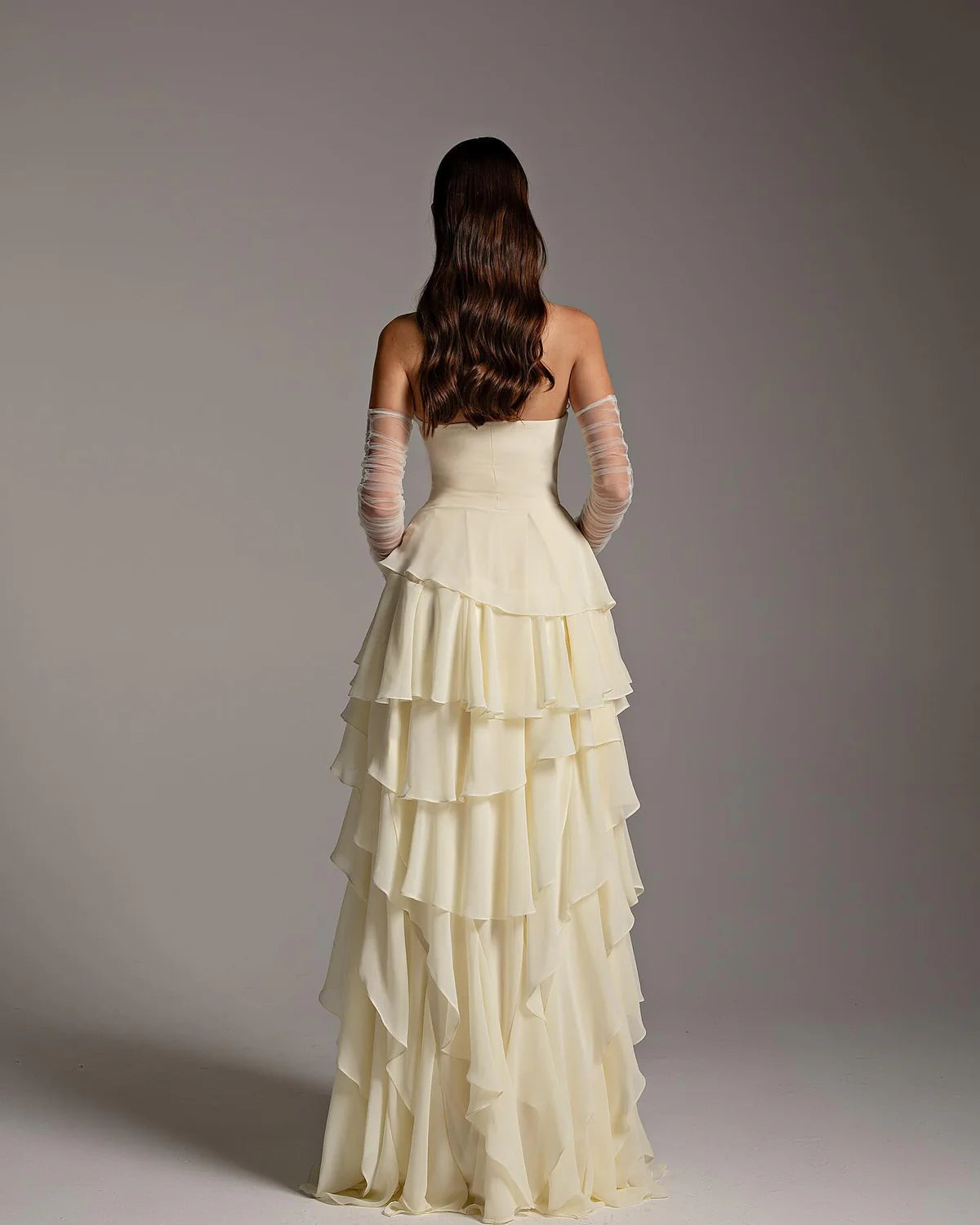The Alexandra Gown is an elegant and sophisticated evening dress, perfect for formal occasions and weddings. Its flattering mermaid silhouette, flowing cut, and long sleeves create a sophisticated look. The unique criss-cross design adds a modern twist to this traditional Arabic design. Make a statement with this stunning piece!
