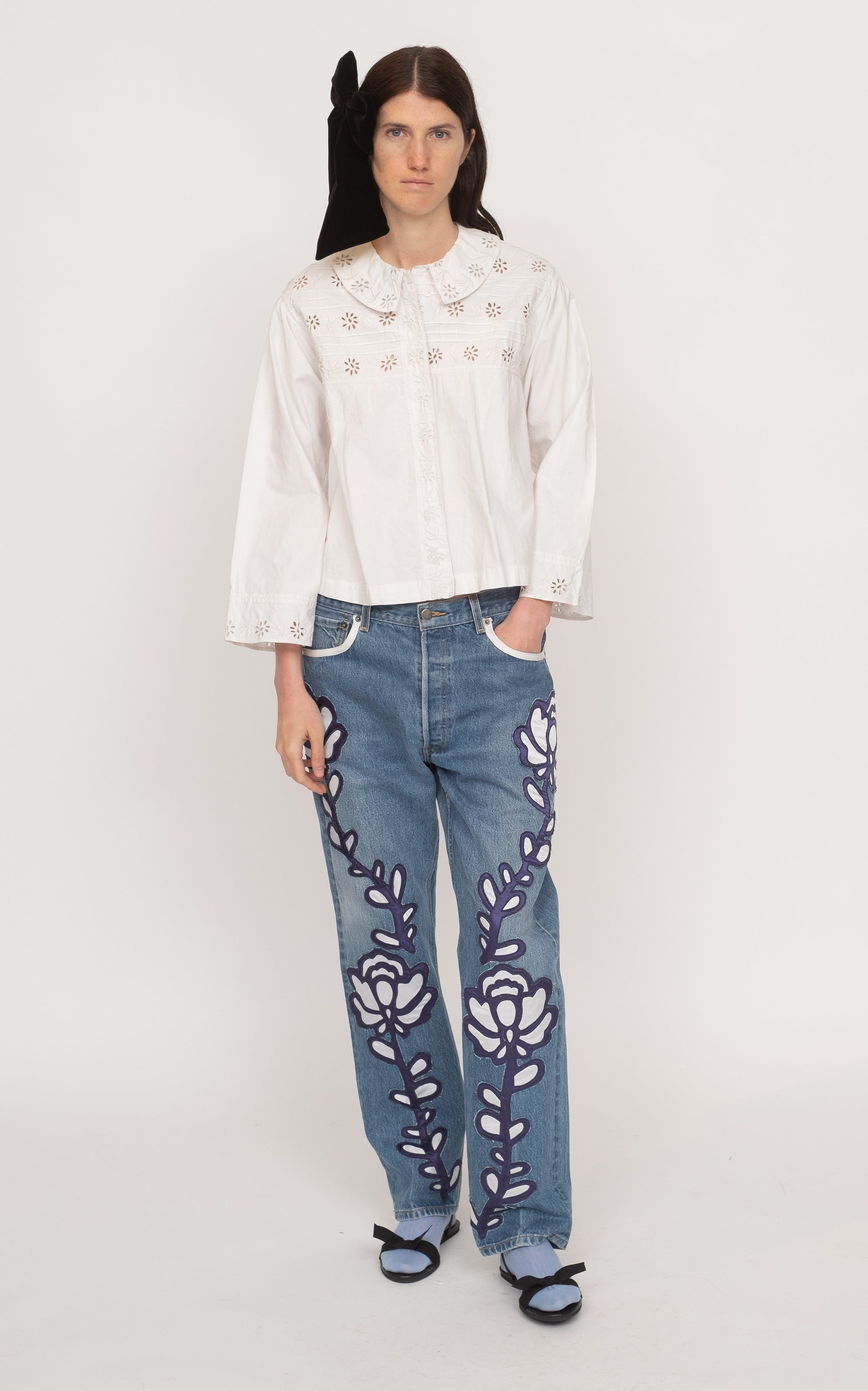 Get ready to rock the fashion world with the Paloma Eyelet Top! This collared top features a relaxed fit and is made with 100% cotton for ultimate comfort. Unlined for a breezy feel, it comes in a classic white color and has a button and zip fastening. Perfect for a casual yet chic look!