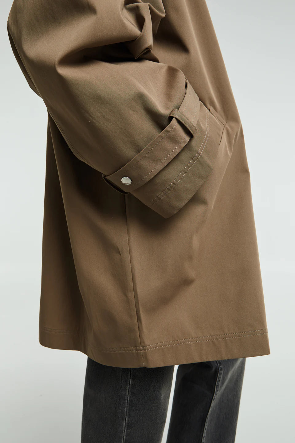 Elevate your everyday wardrobe with this timeless oversized trench jacket by Toteme in a sophisticated hazel tone. Crafted from a breathable cotton blend, it delivers effortless comfort without sacrificing style. The relaxed silhouette provides freedom of movement, making it perfect for layering through seasons. Whether you're dressing up or down, this minimalist essential transitions seamlessly from office to weekend, becoming the versatile piece you'll reach for again and again.