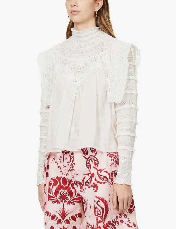 Upgrade your wardrobe with your new favorite top - the Giulia Ruffled Embroidered Cotton-Blend Blouse! Crafted from a luxurious cotton and silk blend, this blouse features delicate broderie anglaise details at the neckline and charming ruffle trim. Each wear will bring a touch of whimsy and romance to your day.