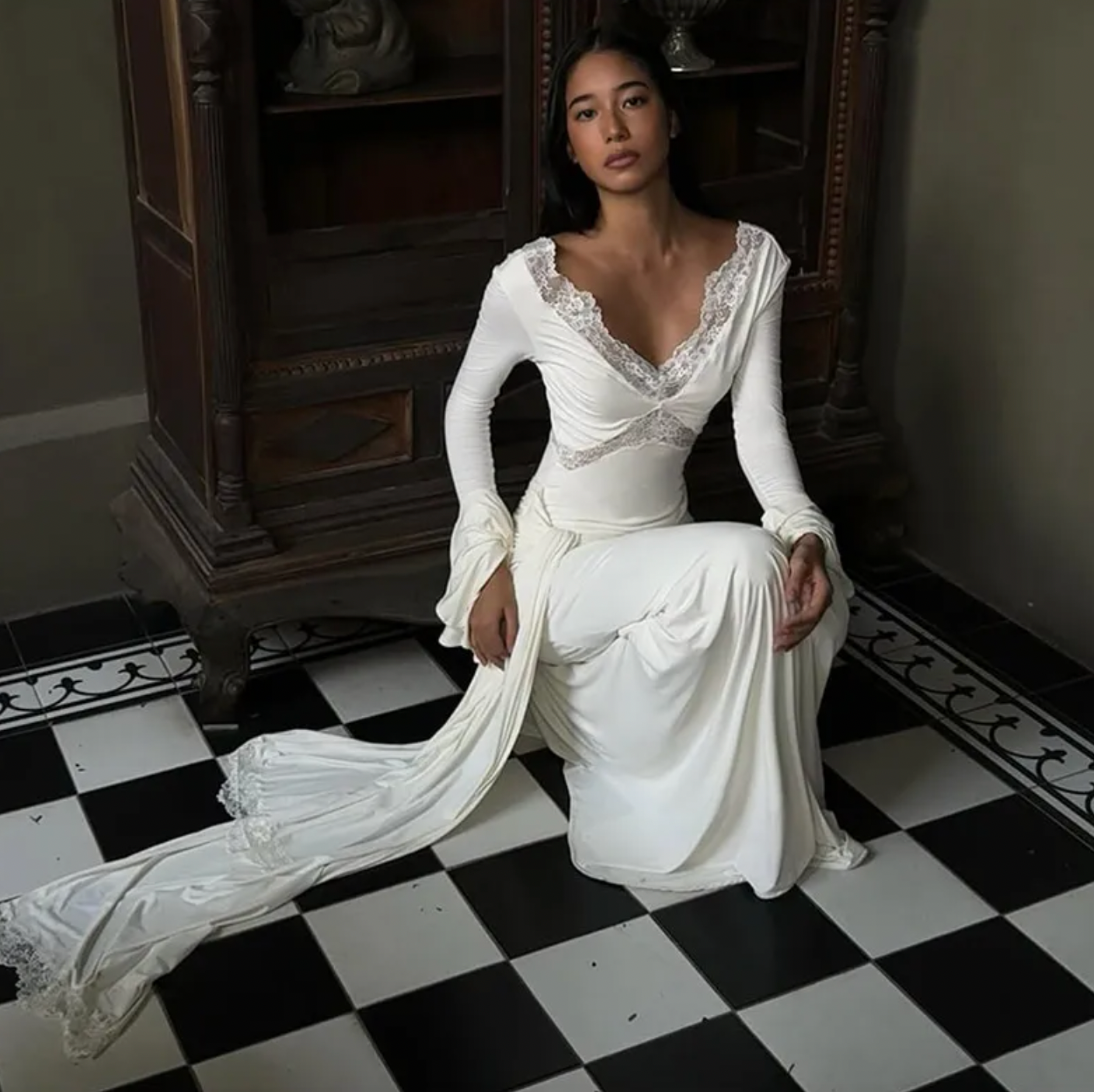 The Electra dress offers a stunning blend of elegance and allure with its fitted silhouette and intricate lace detailing. Featuring a deep V lace neckline and delicate cut-outs, this dress exudes sophistication while the cascading front-side tie adds fluidity to your movement. Flared layered sleeves contribute a vintage-inspired charm, and the partial lining ensures both comfort and style. Ideal for evening occasions, the Electra dress makes a bold and graceful statement that leaves a lasting impression.