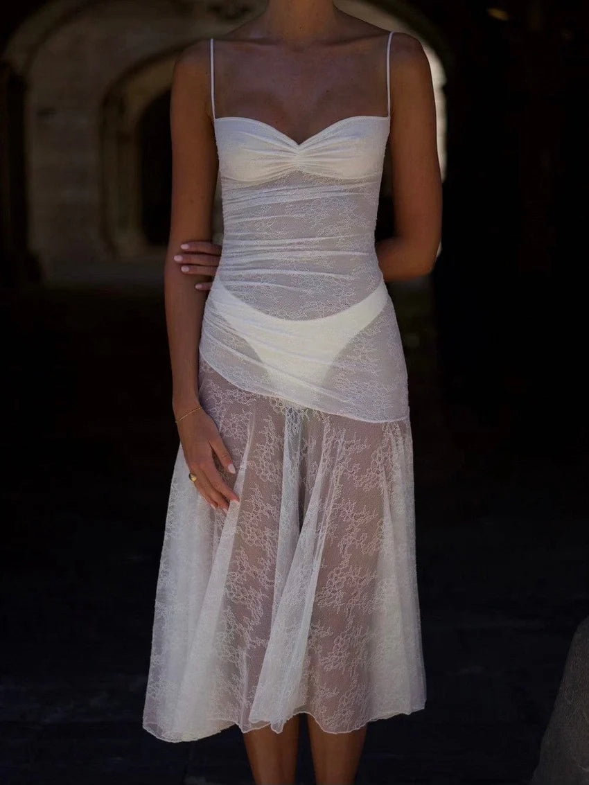 Indulge in elegance with the Adela Lace Dress. This delicate and daring piece features a feminine silhouette, sweetheart neckline, and sheer double layered lace for a charming touch. With a midi length perfect for any summer occasion, this dress exudes luxury and sophistication.