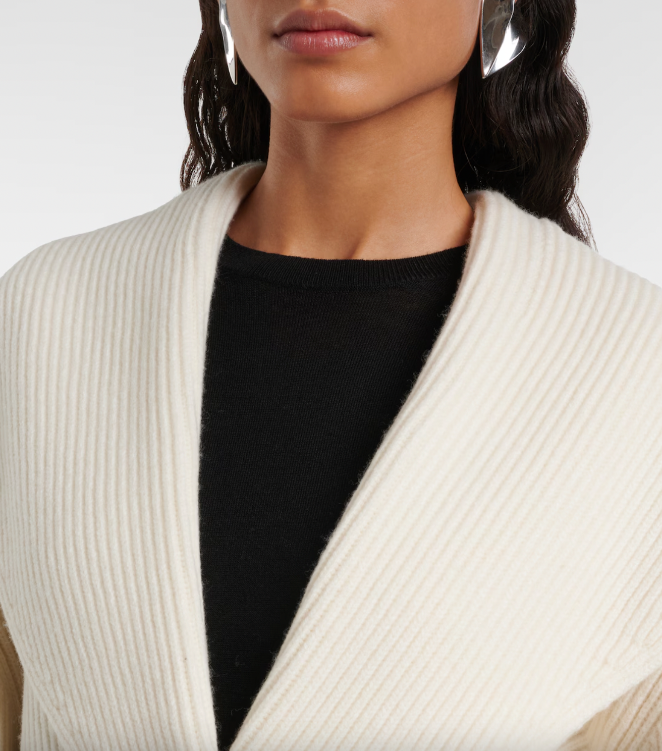 Elevate your wardrobe with this shawl-lapels cardigan from Toteme, a brand renowned for its modern, refined approach to dressing. Designed with a slightly oversized fit and rounded sleeves, it adds sophisticated volume and effortless layering to any outfit. Crafted for comfort and style, this sculptural piece is perfect for defining your personal dress code while staying cozy and polished.