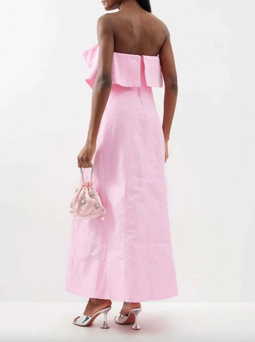 Elevate your evening wardrobe with the Aje Shallows Strapless Linen-Blend Gown in blush pink. This sophisticated piece features a strapless neckline adorned with an asymmetrical draped overlay, creating an elegant focal point. Internal boning provides a sculpted silhouette while the fitted bodice transitions into a graceful column skirt that moves beautifully with every step. Practical side seam pockets add everyday functionality to this statement piece. 