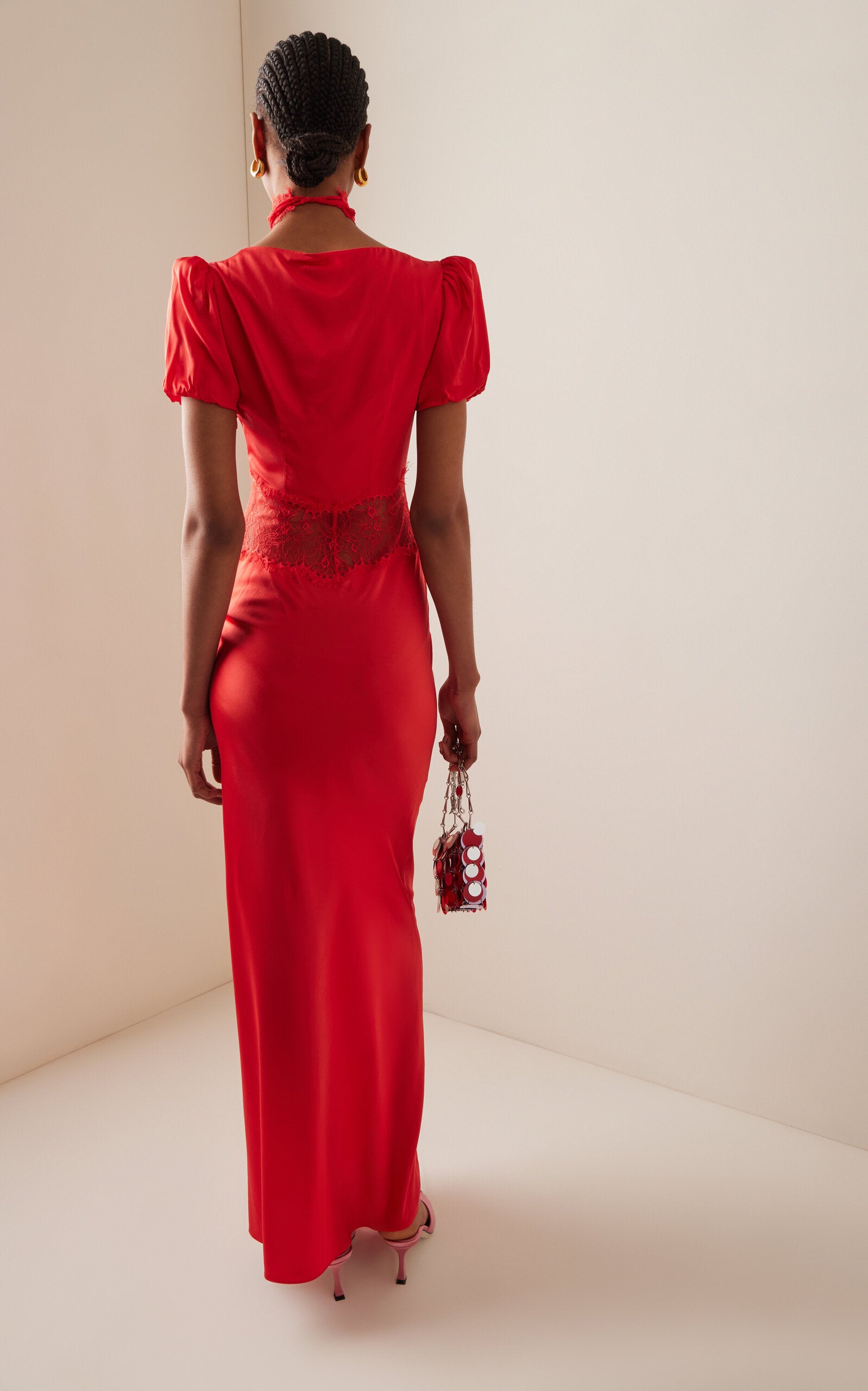 The Pavlova Maxi Dress from De La Vali embodies bold elegance with a bohemian edge. Crafted from a luxurious silk blend, it features delicate lace trimming that elevates its refined design. Its flowing silhouette moves gracefully, offering effortless confidence and making it a standout piece for any occasion. Embrace artistry and sophistication with this captivating maxi dress that honors the spirit of muse Vali Myers.