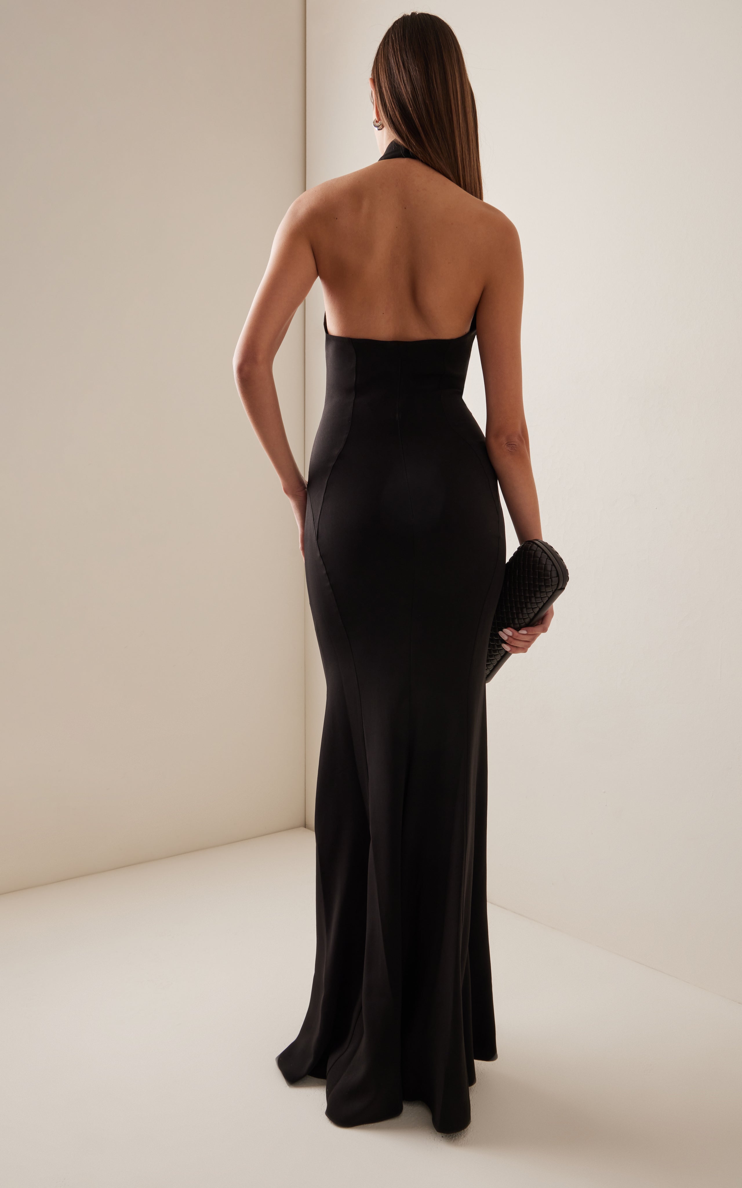 Make a statement in the Crystal-Embellished Cady Halter Maxi Dress by Zuhair Murad! Crafted from luxurious cady fabric, this halter gown boasts a slim, figure-flattering silhouette. The beautiful teardrop crystal embellishments add a touch of elegance and glamour to any evening occasion. Complete the look with a stunning crystal clutch for a truly showstopping ensemble.