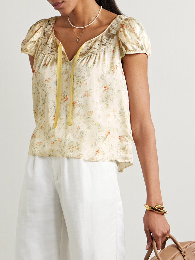 Indulge in the luxurious feel of the DOEN Camri Silk Top. Made from soft silk-satin, this top is adorned with a delicate corded lace trim and a vibrant floral print. Elevate any outfit with this bold and elegant piece. Feel confident and stylish in the Camri Silk Top.