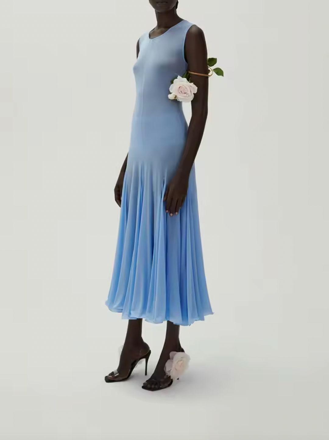 Introducing the Short Sleeve Midi Dress by Magda Butrym. Made with lightweight jersey fabric and elegant pleating, this dress drapes beautifully on your figure. Elevate your wardrobe with this luxurious piece and don't forget to consider undergarments for the sheer finish. Embrace the unexpected with Magda Butrym.