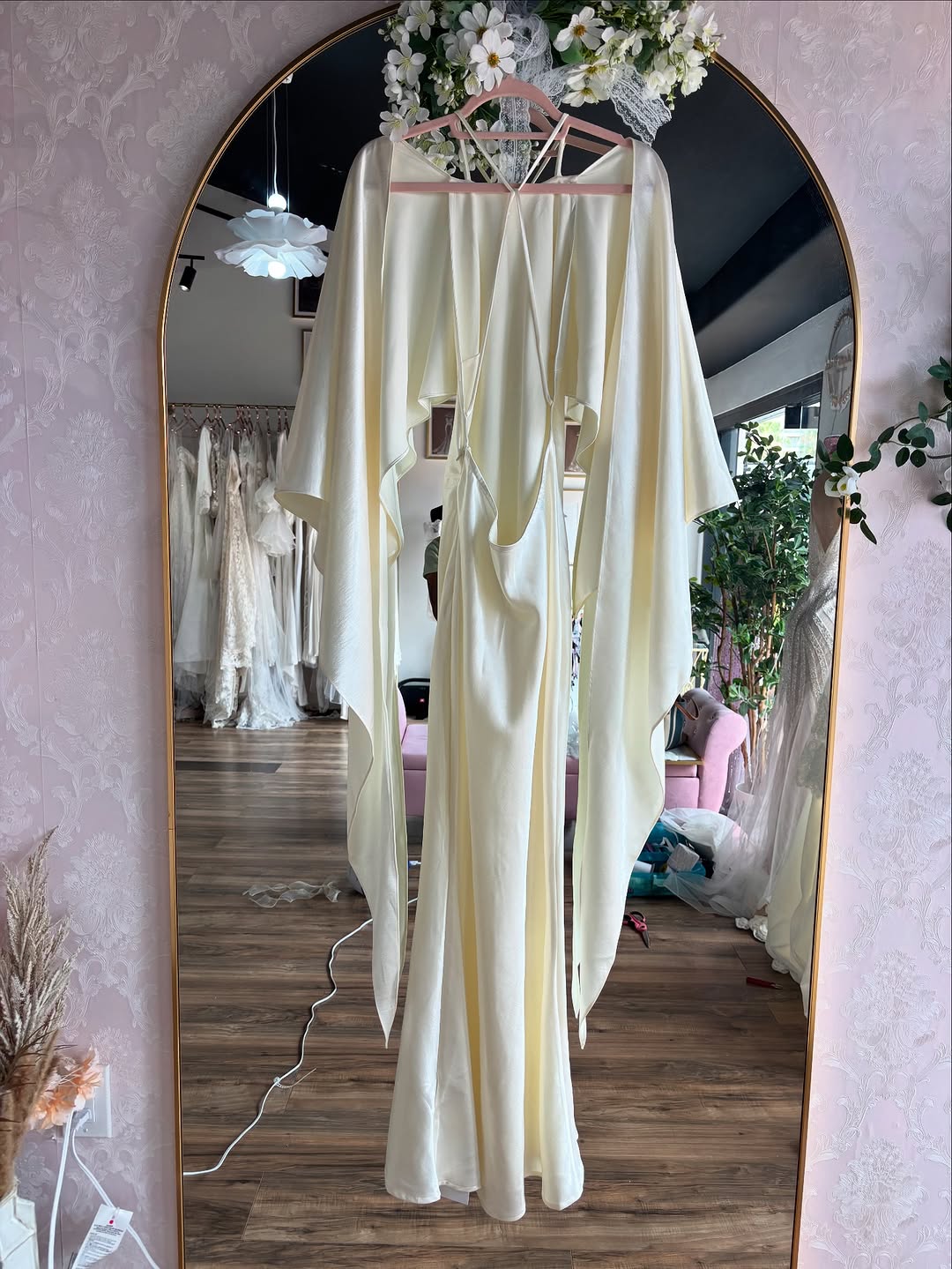 The Jeany Silk Dress delights with adjustable straps and a chic halter neckline, perfectly complemented by elegant back buttons and bias stitching that beautifully drapes your silhouette. Designed to flirt with the floor when paired with heels, it offers a stunningly elongated look—just the right excuse for a little hemming fun! The playful ties at the back ensure a fit as unique as you are, combining charm and comfort for those unforgettable special moments.