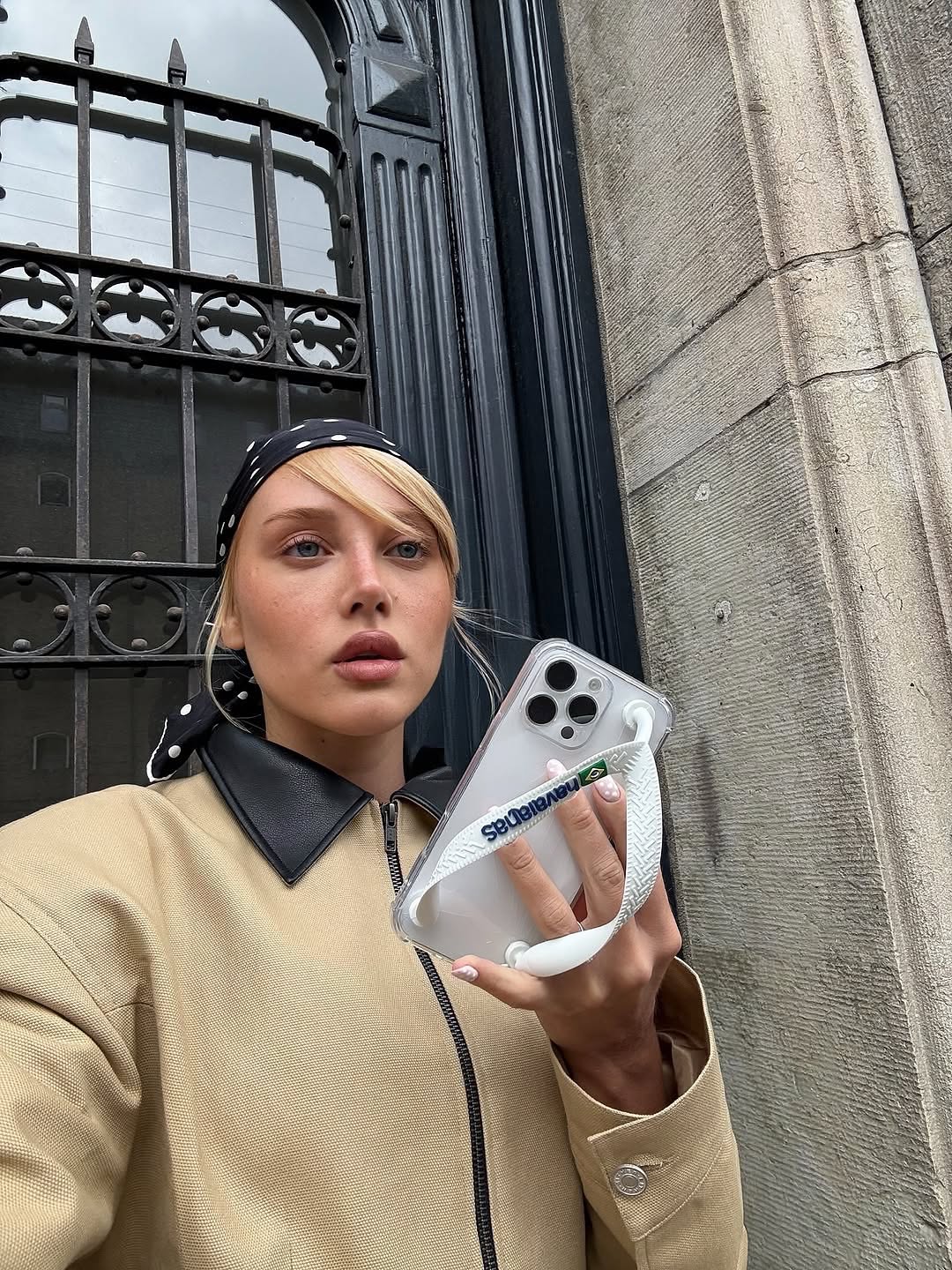 Hourglass Canvas Jacket Master the art of effortless sophistication with this canvas work jacket that refuses to compromise on style. The sculpted hourglass silhouette flatters your frame while bold padded shoulders project quiet confidence. A striking leather collar elevates the everyday, transforming a utilitarian piece into a statement. Adjustable buttoned tabs at the back give you complete control over your fit—customize it to perfection.