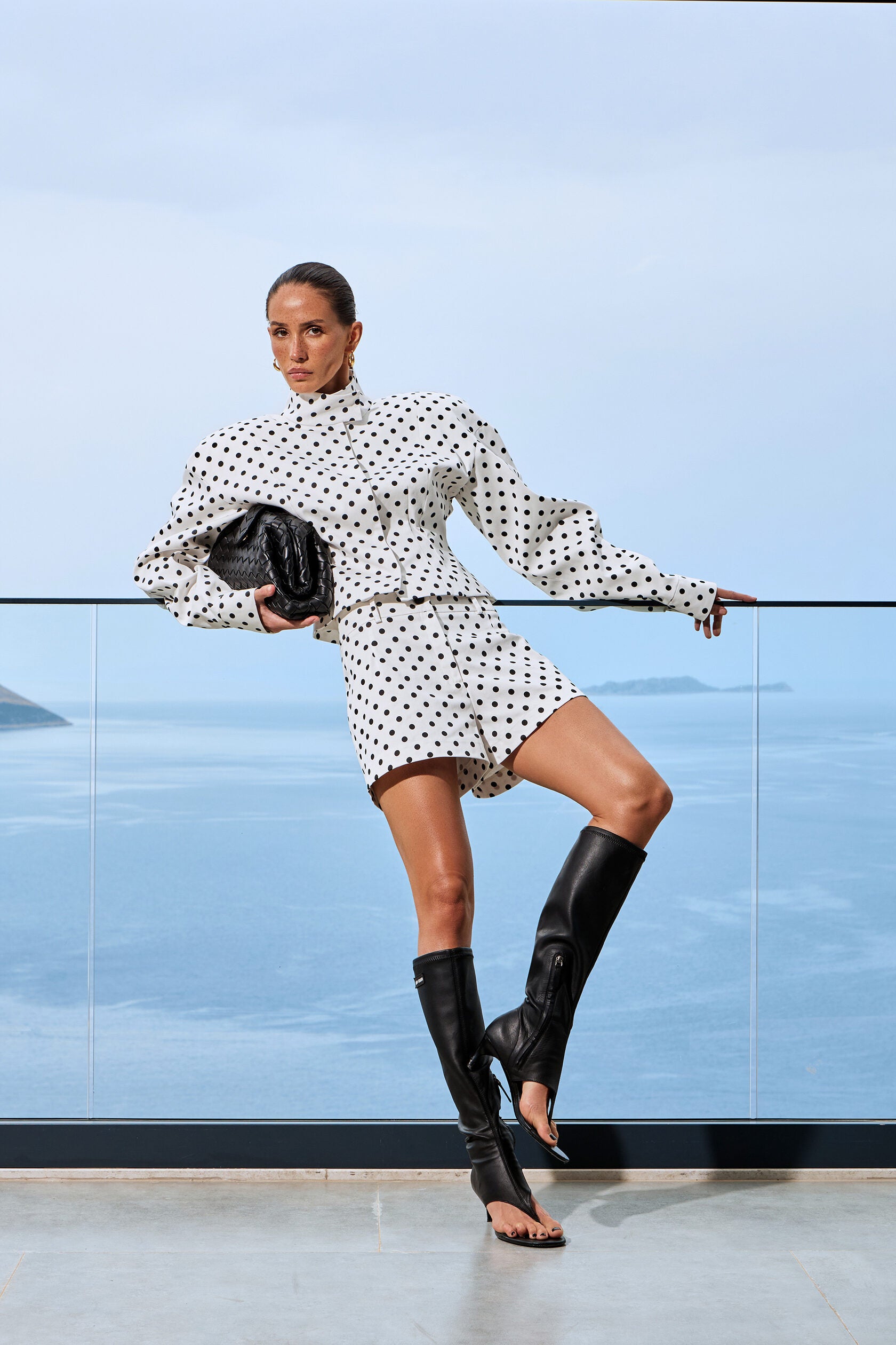 Elevate your casual wardrobe with this two-piece polka dot set featuring a standout stand collar jacket and coordinating shorts. The relaxed silhouette and long sleeves deliver effortless sophistication, while the playful dot pattern adds contemporary flair. Perfect for creating that coveted casual-chic aesthetic, this versatile ensemble transitions seamlessly from weekend errands to night-out moments. Embrace edgy streetwear style without compromising comfort.