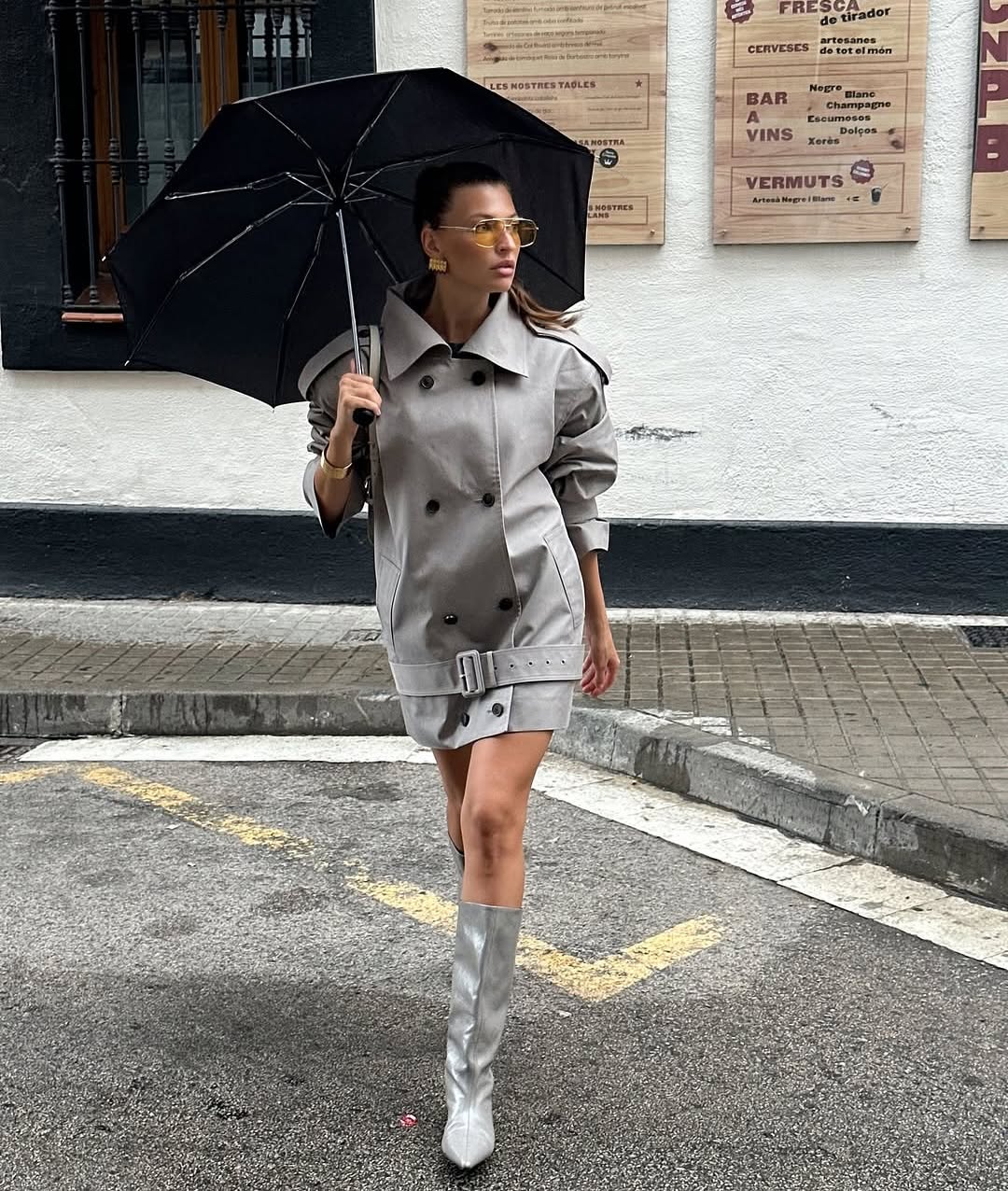 The Major Trench Jacket by Helsa blends classic style with practical features to elevate your wardrobe. Its front button closure and padded shoulders ensure both comfort and a sharp silhouette, while epaulettes and belted cuffs add refined detail. Made from durable gabardine fabric, this jacket offers versatility and long-lasting wear. Side seam pockets provide convenient storage, and the optional belt lets you customize your fit. Perfect for any season, it’s the ideal choice for a polished, confident look.